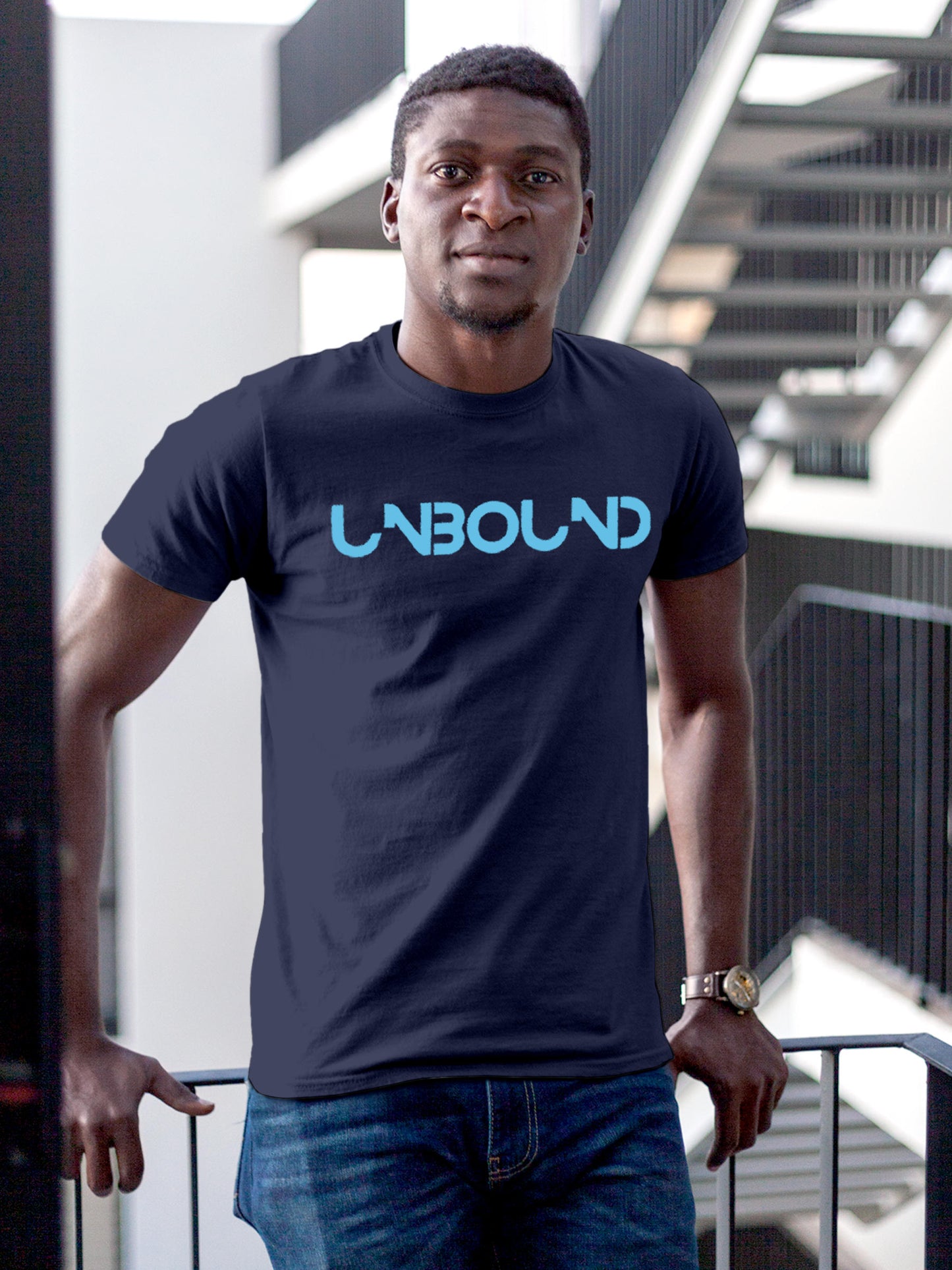 Model wearing Men's Navy Blue Round Neck T-shirt with 'Unbound' design, offering effortless style and premium comfort