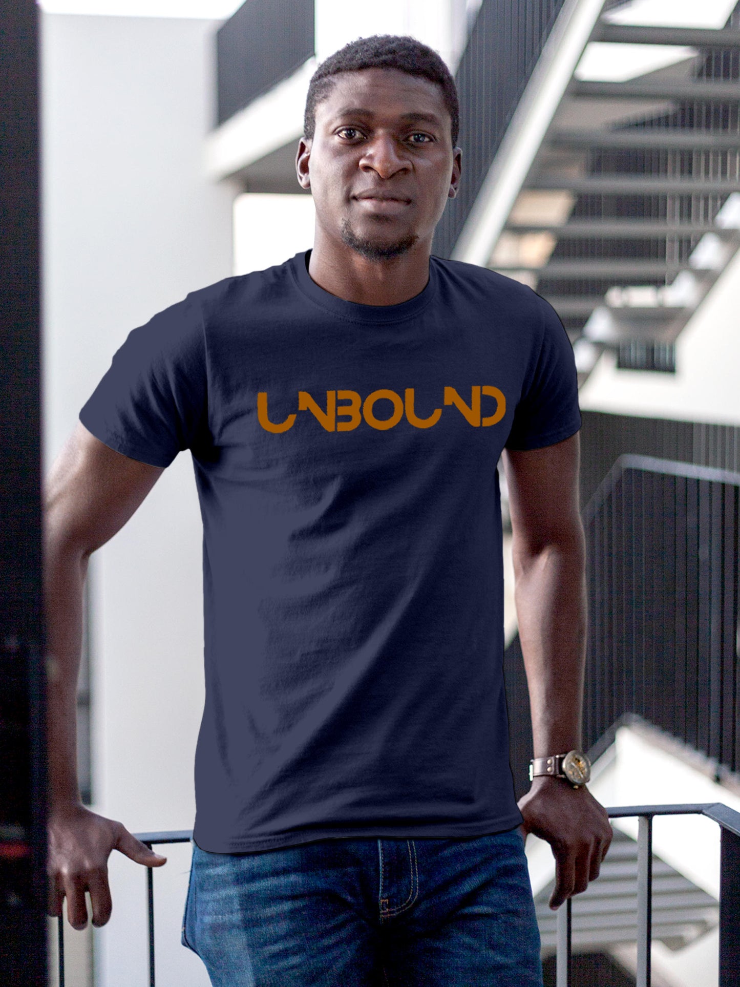 Model wearing Men's Navy Blue Round Neck T-shirt with 'Unbound' design, offering effortless style and premium comfort