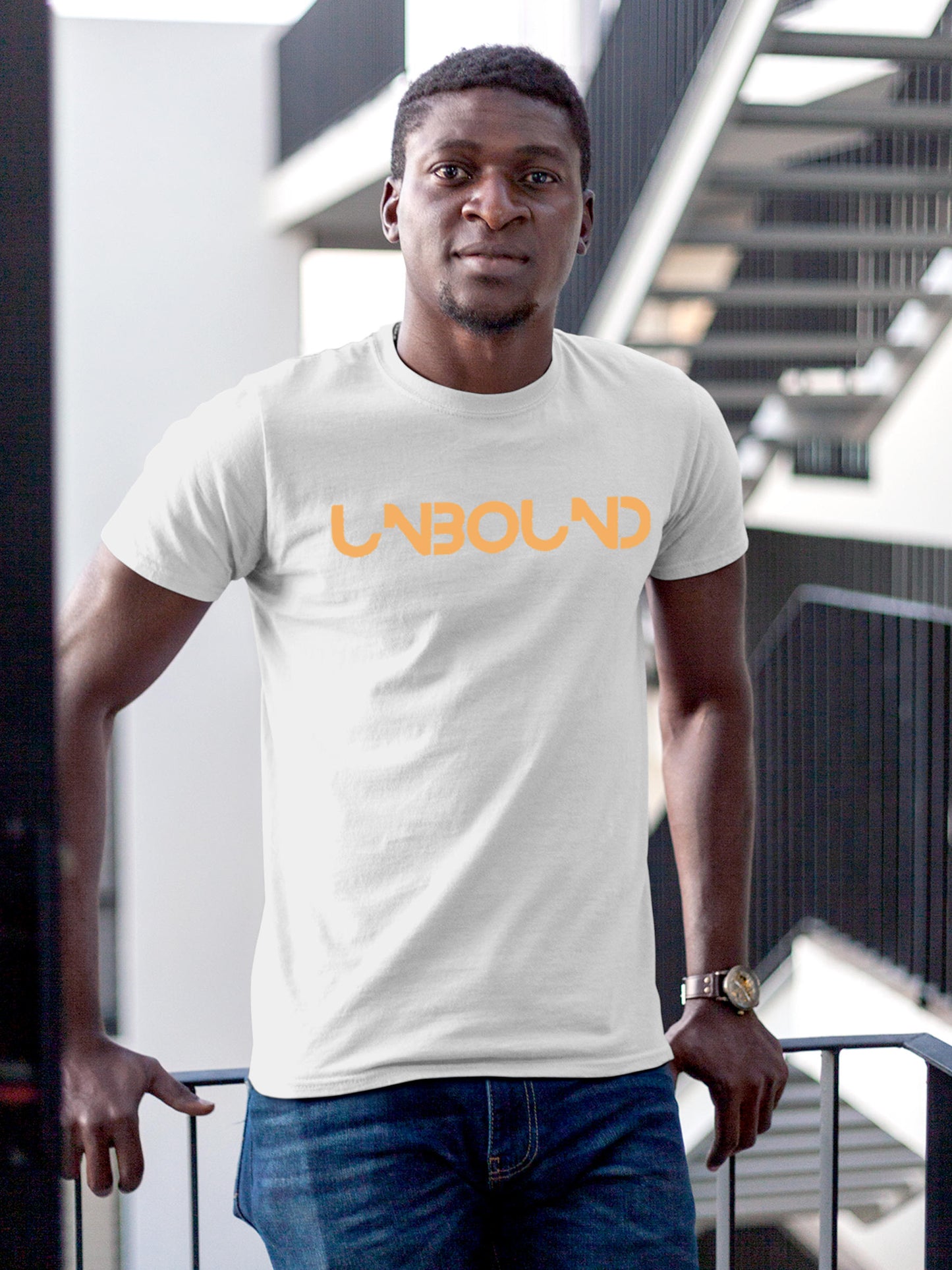 Model wearing Men's White Round Neck T-shirt with 'Unbound' design, offering effortless style and premium comfort