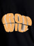 Close up of 'Iron Will' design on Women's Black Round Neck T-shirt, highlighting intricate details and vibrant print.