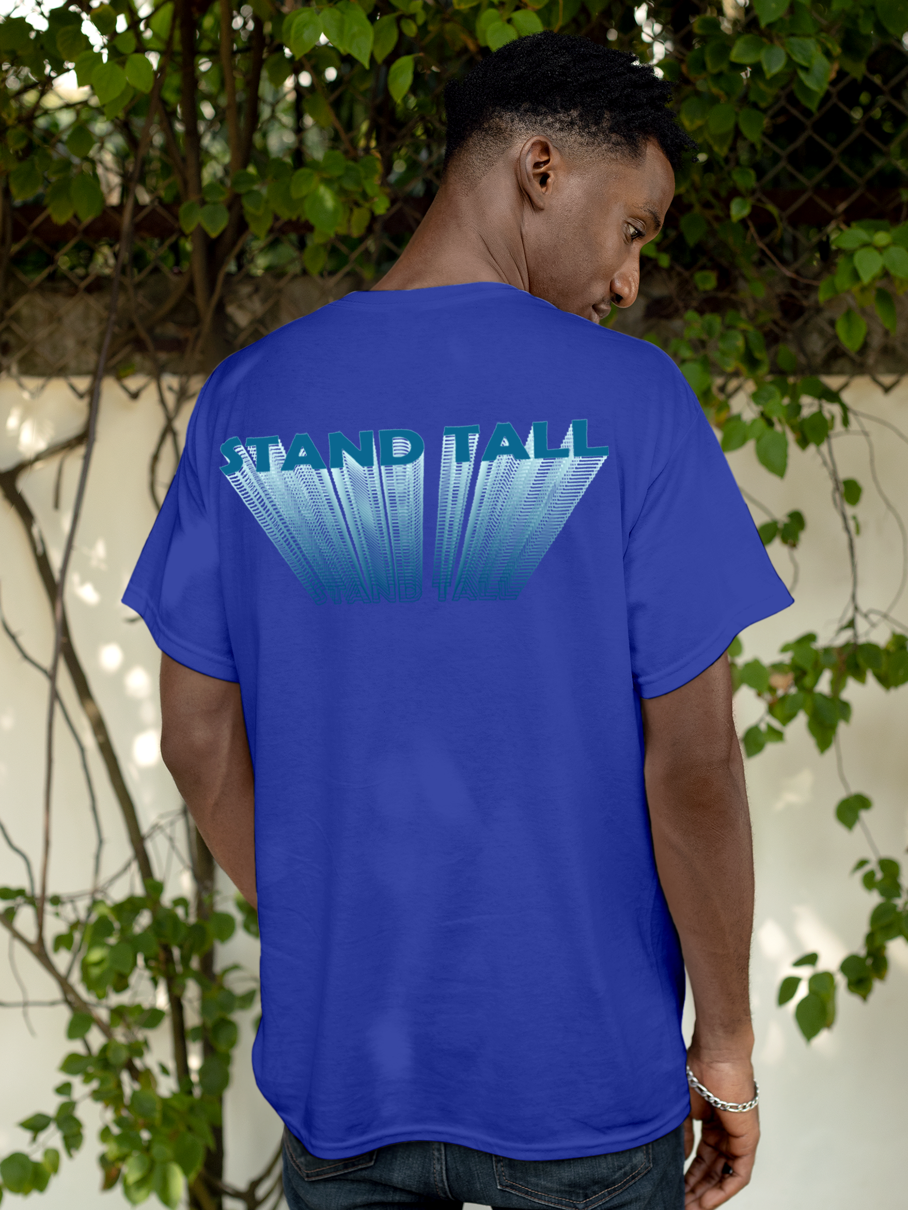 Model wearing Men's Blue Round Neck T-shirt with 'Stand Tall' design, offering effortless style and premium comfort