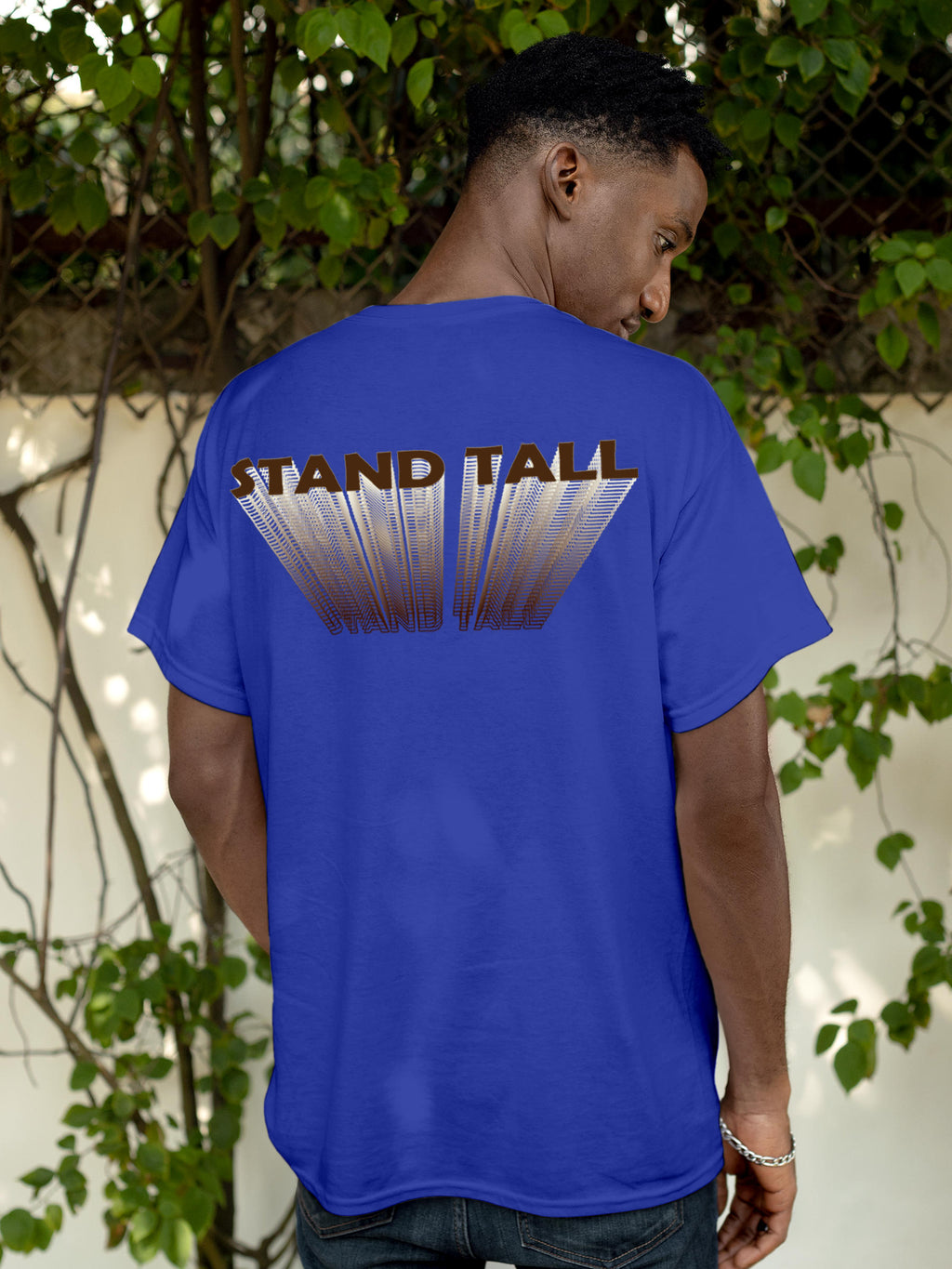 Model wearing Men's Blue Round Neck T-shirt with 'Stand Tall' design, offering effortless style and premium comfort