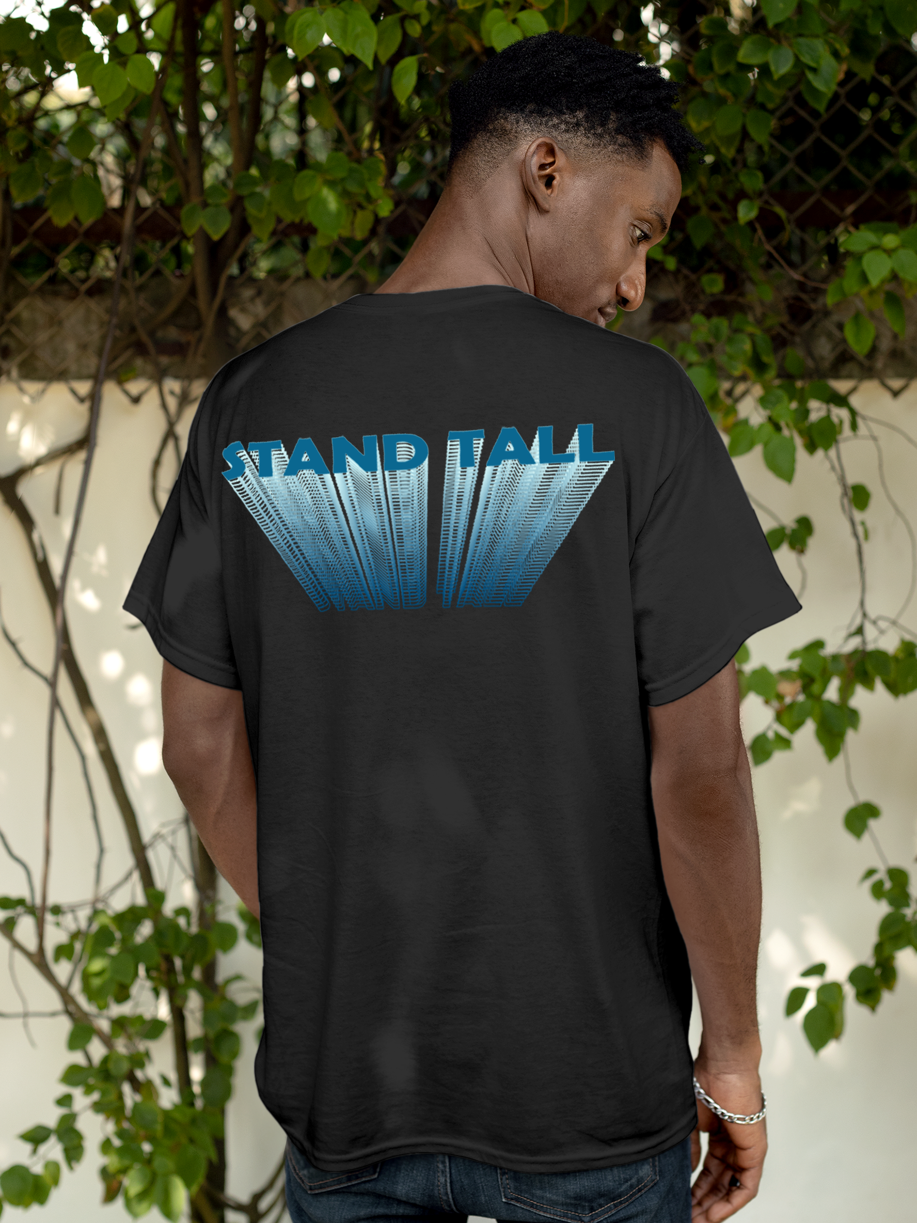 Model wearing Men's Dark Grey Round Neck T-shirt with 'Stand Tall' design, offering effortless style and premium comfort