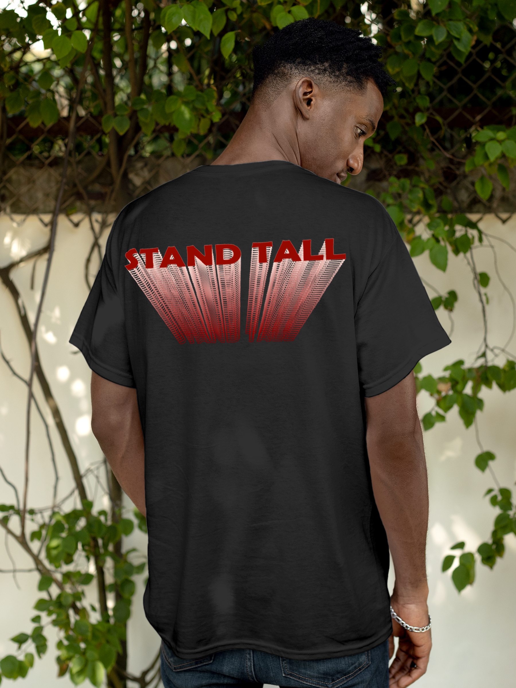 Model wearing Men's Dark Grey Round Neck T-shirt with 'Stand Tall' design, offering effortless style and premium comfort