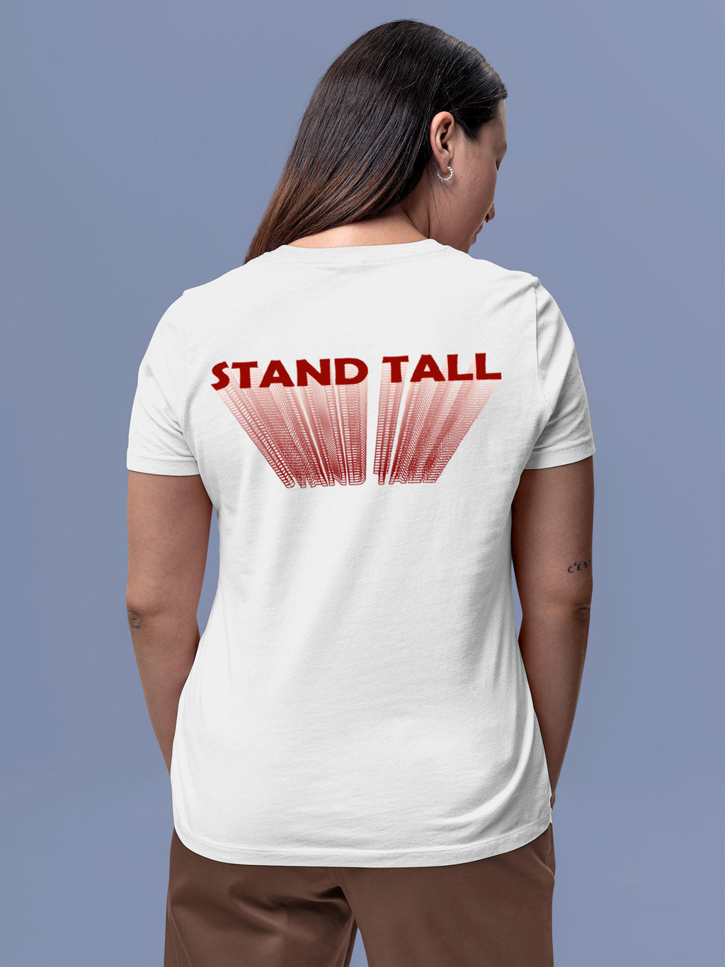 Model wearing Women's White Round Neck T-shirt with 'Stand Tall' design, offering effortless style and premium comfort