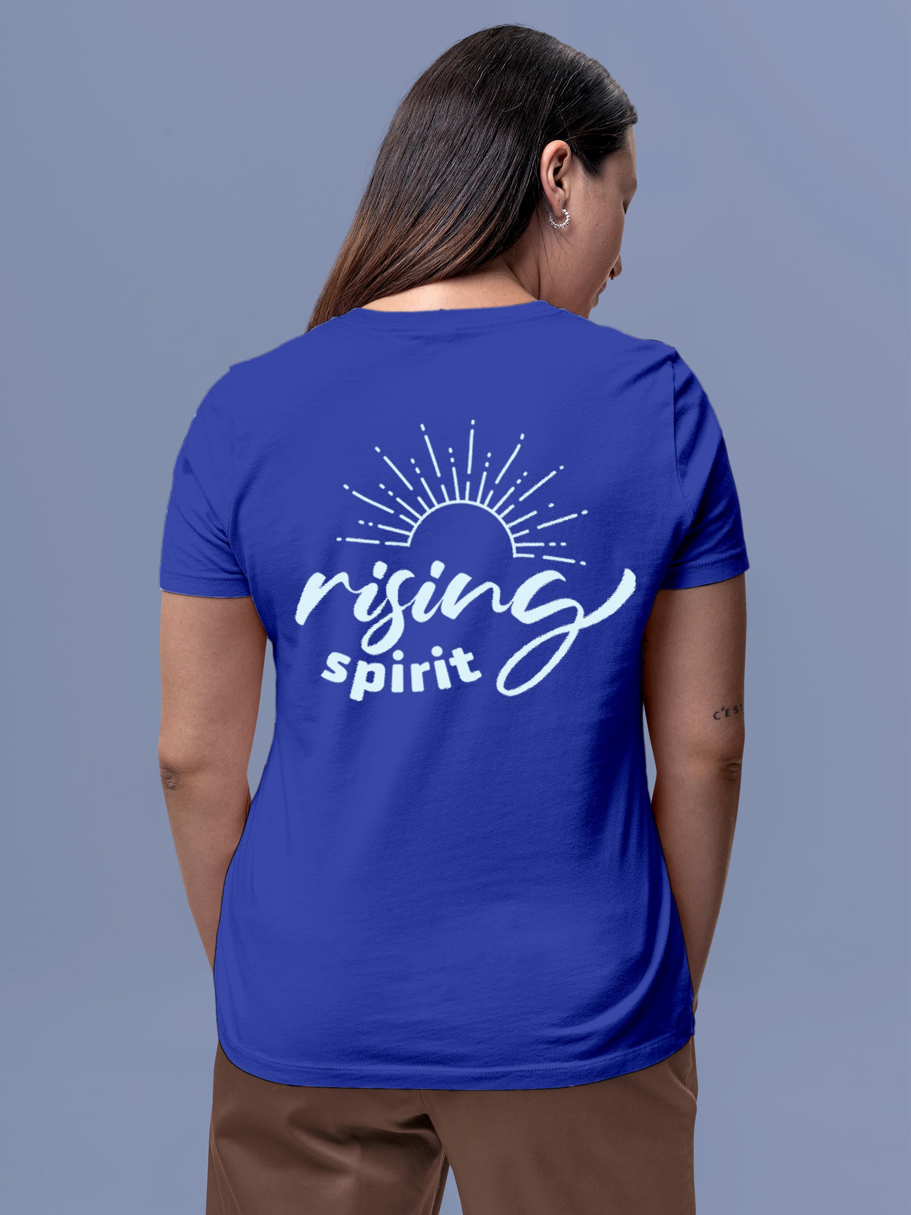 Model wearing Women's Blue Round Neck T-shirt with 'Rising Spirit' design, offering effortless style and premium comfort
