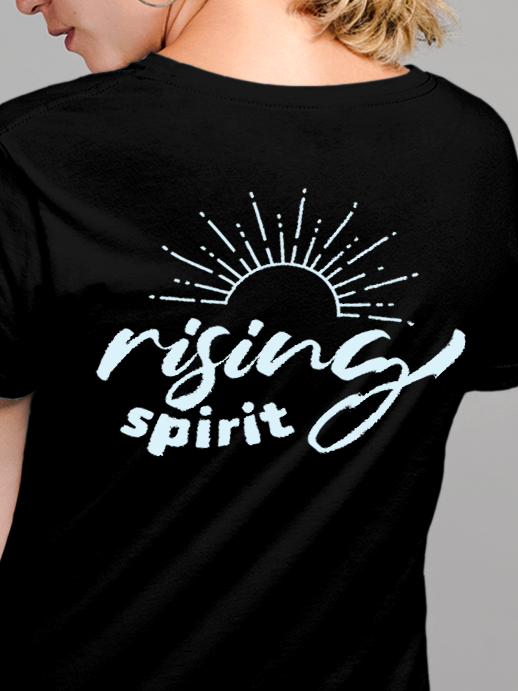 Close up of 'Rising Spirit' design on Women's Black Round Neck T-shirt, highlighting intricate details and vibrant print.