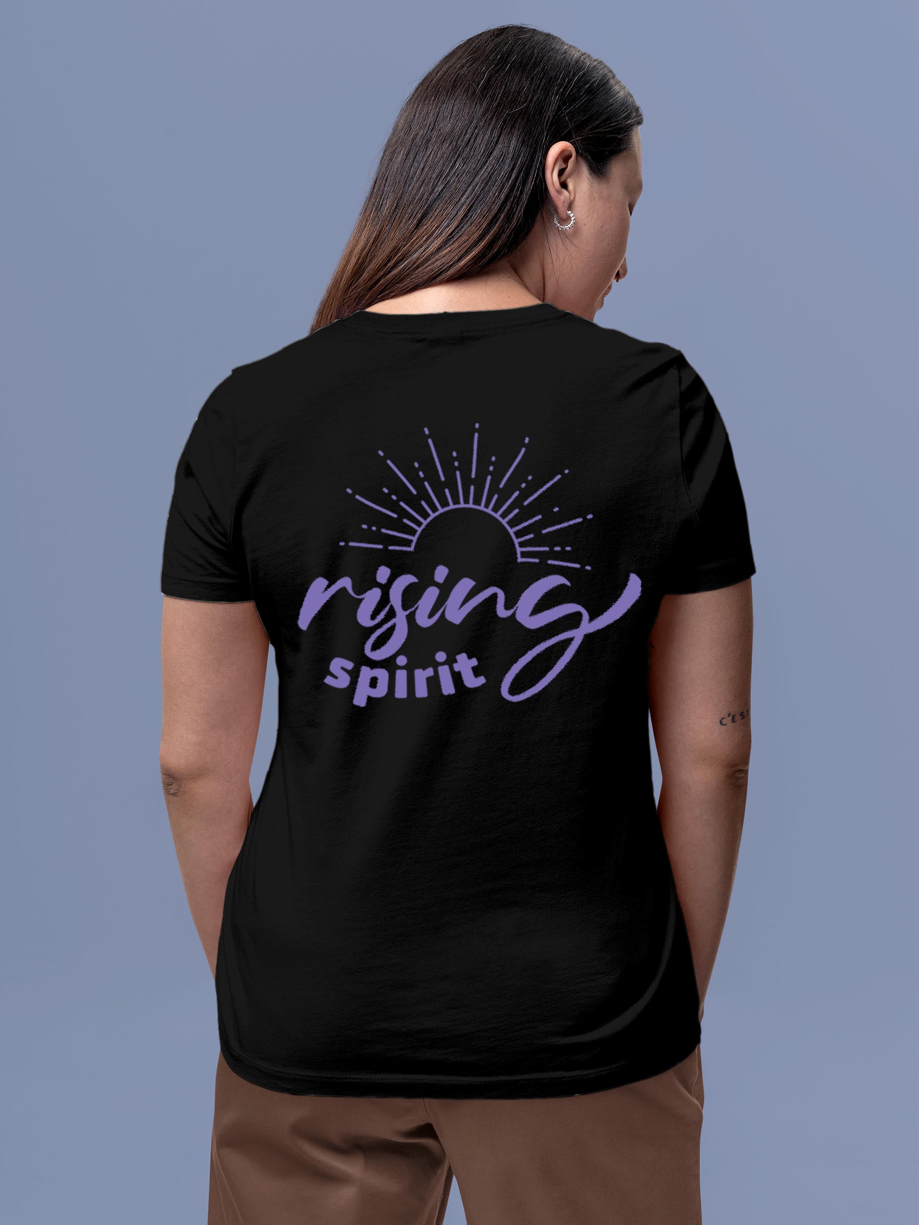 Model wearing Women's Black Round Neck T-shirt with 'Rising Spirit' design, offering effortless style and premium comfort