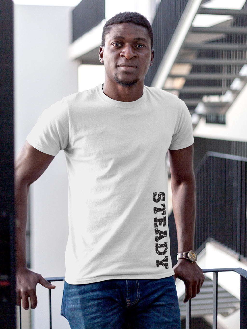 Model wearing Men's White Round Neck T-shirt with 'Steady' design, offering effortless style and premium comfort