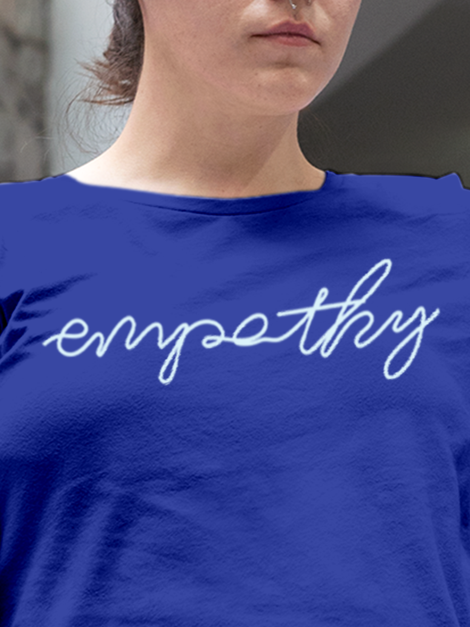 Close up of 'Empathy' design on Women's Blue Round Neck T-shirt, highlighting intricate details and vibrant print.