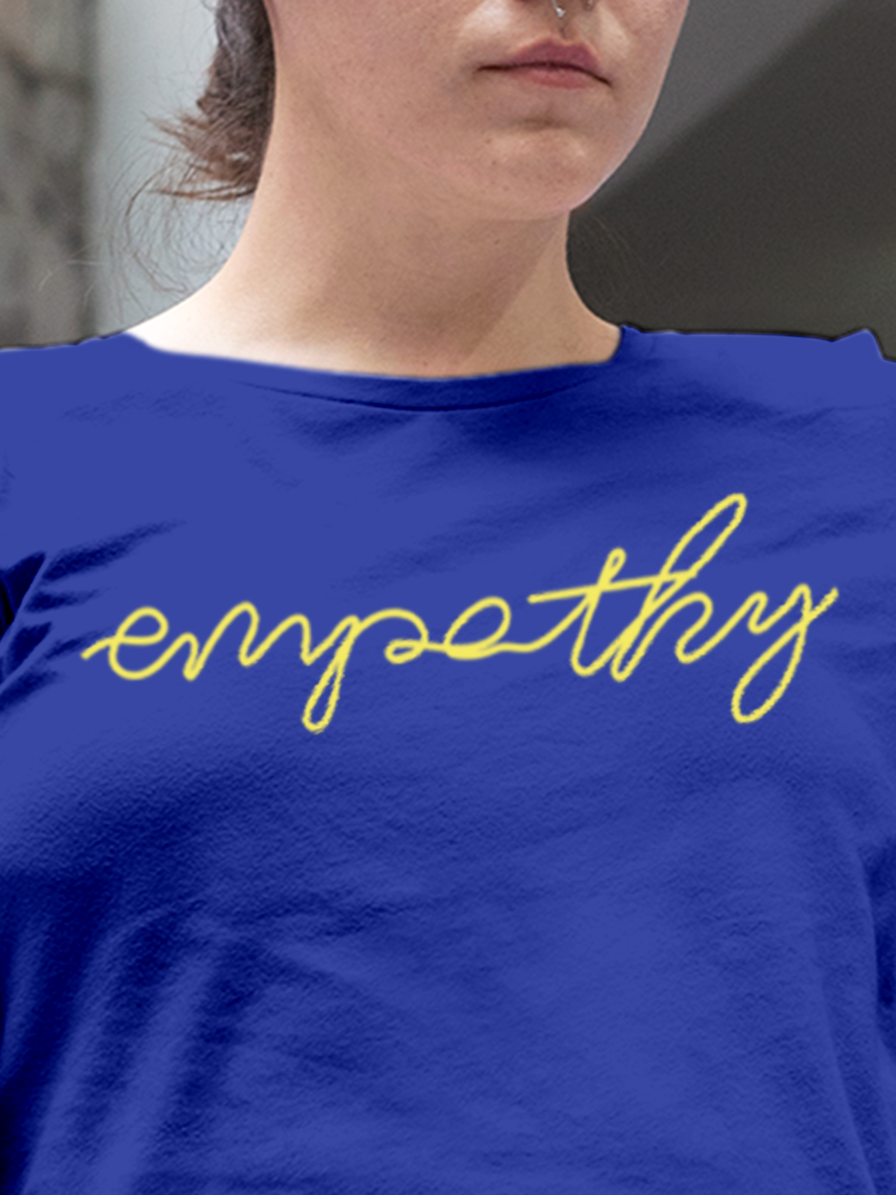 Close up of 'Empathy' design on Women's Blue Round Neck T-shirt, highlighting intricate details and vibrant print.