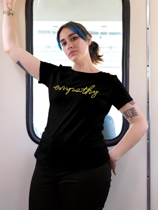 Model wearing Women's Black Round Neck T-shirt with 'Empathy' design, offering effortless style and premium comfort