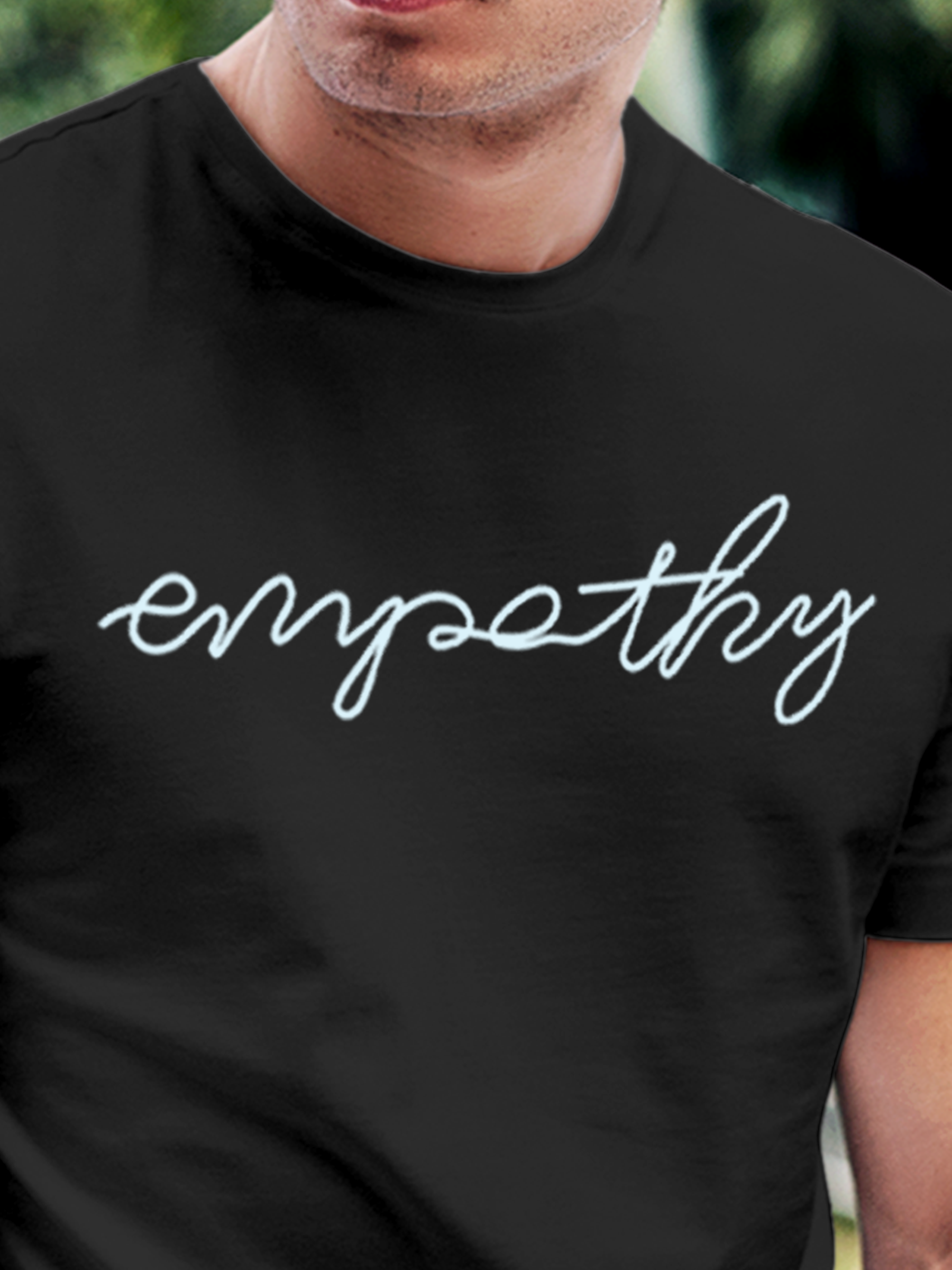 Close up of 'Empathy' design on Men's Charcoal Grey Round Neck T-shirt, highlighting intricate details and vibrant print.