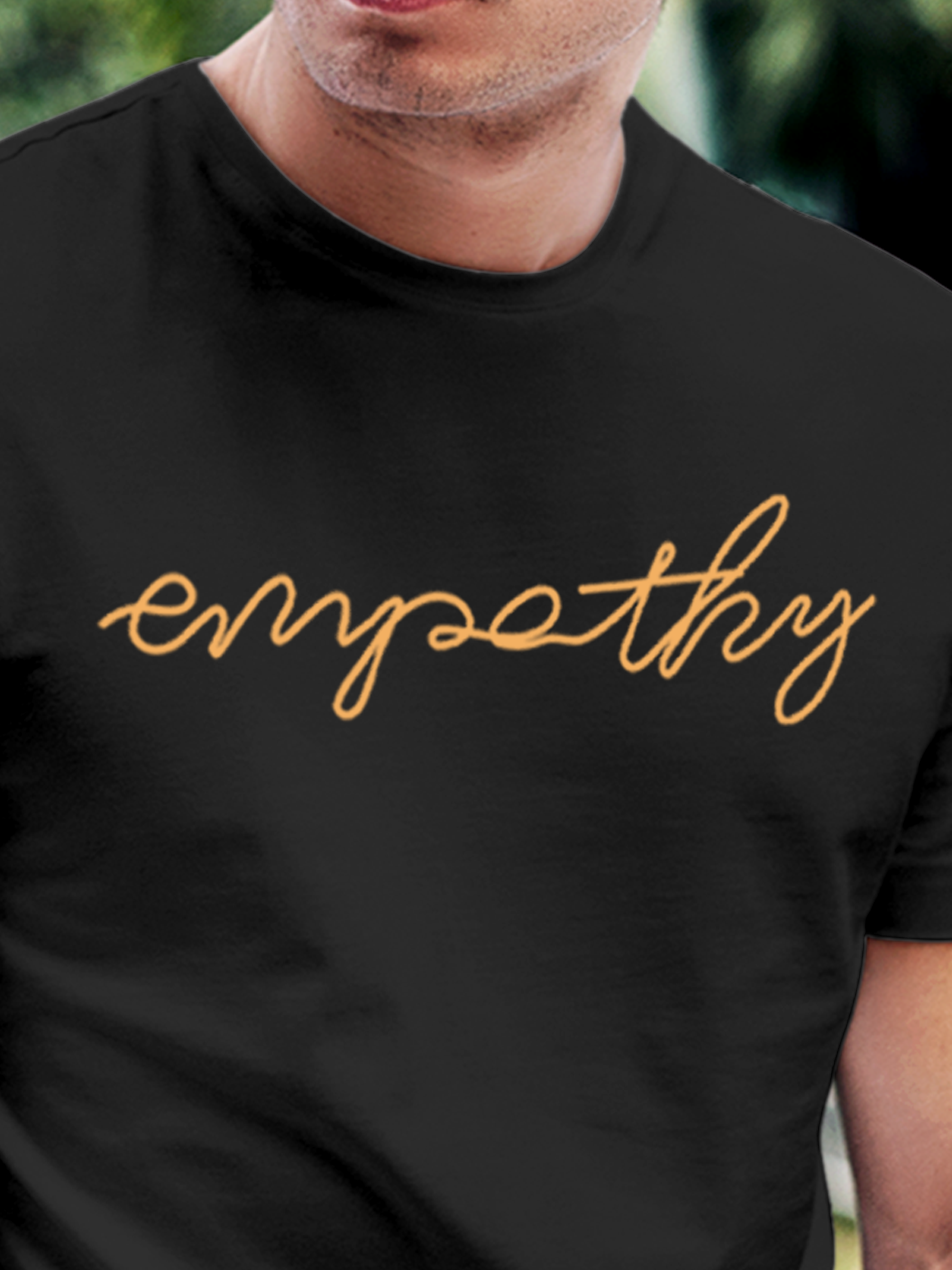 Close up of 'Empathy' design on Men's Charcoal Grey Round Neck T-shirt, highlighting intricate details and vibrant print.