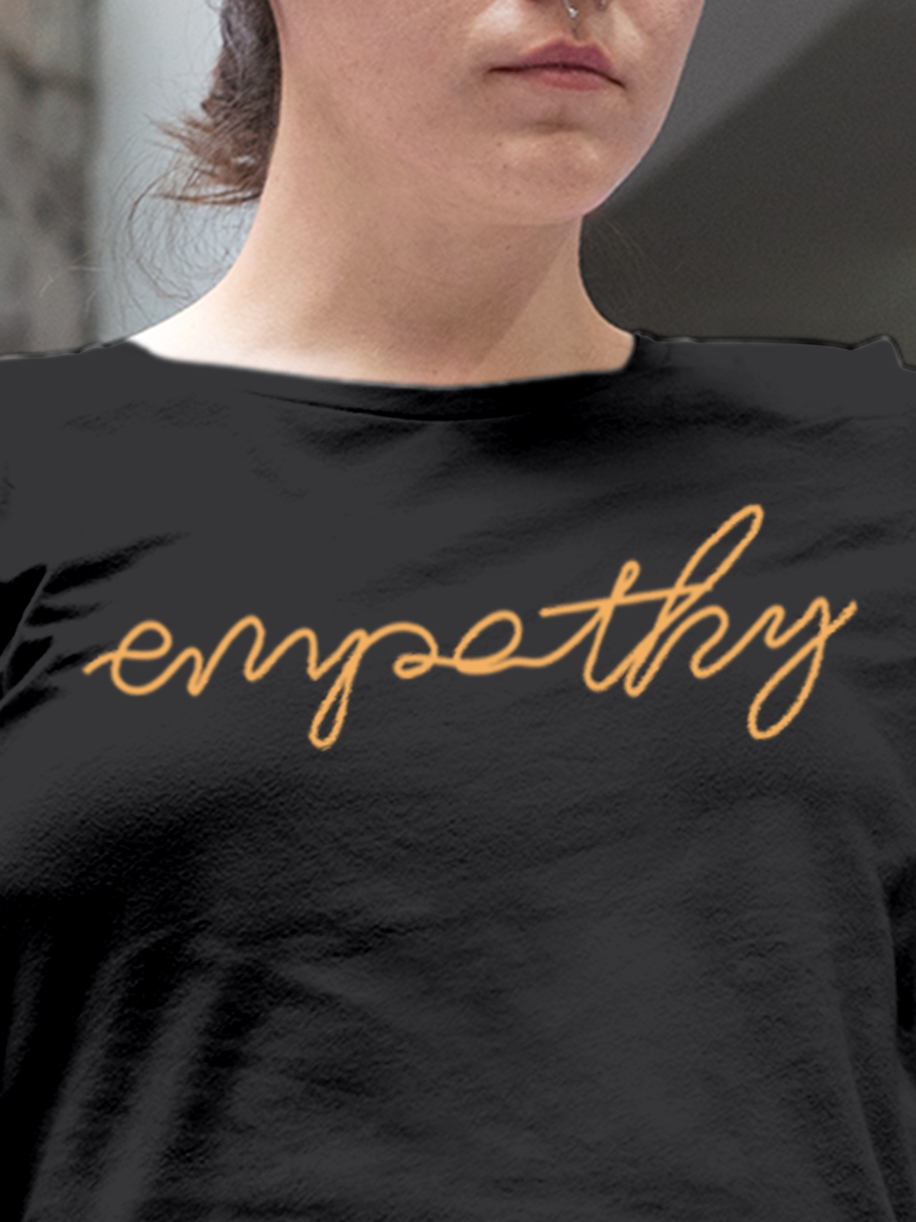 Close up of 'Empathy' design on Women's Charcoal Grey Round Neck T-shirt, highlighting intricate details and vibrant print.