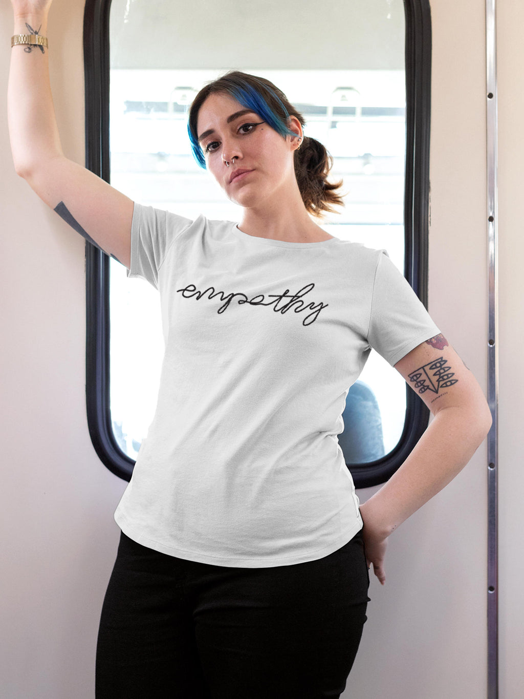 Model wearing Women's White Round Neck T-shirt with 'Empathy' design, offering effortless style and premium comfort
