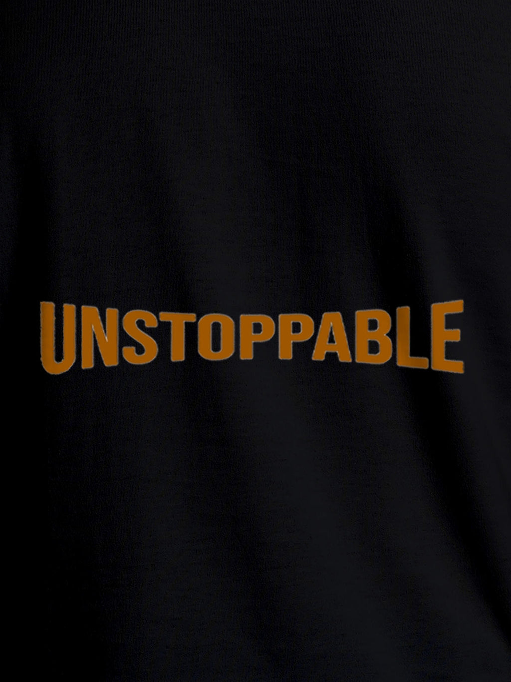 Close up of 'Unstoppable' design on Men's Black Round Neck T-shirt, highlighting intricate details and vibrant print.