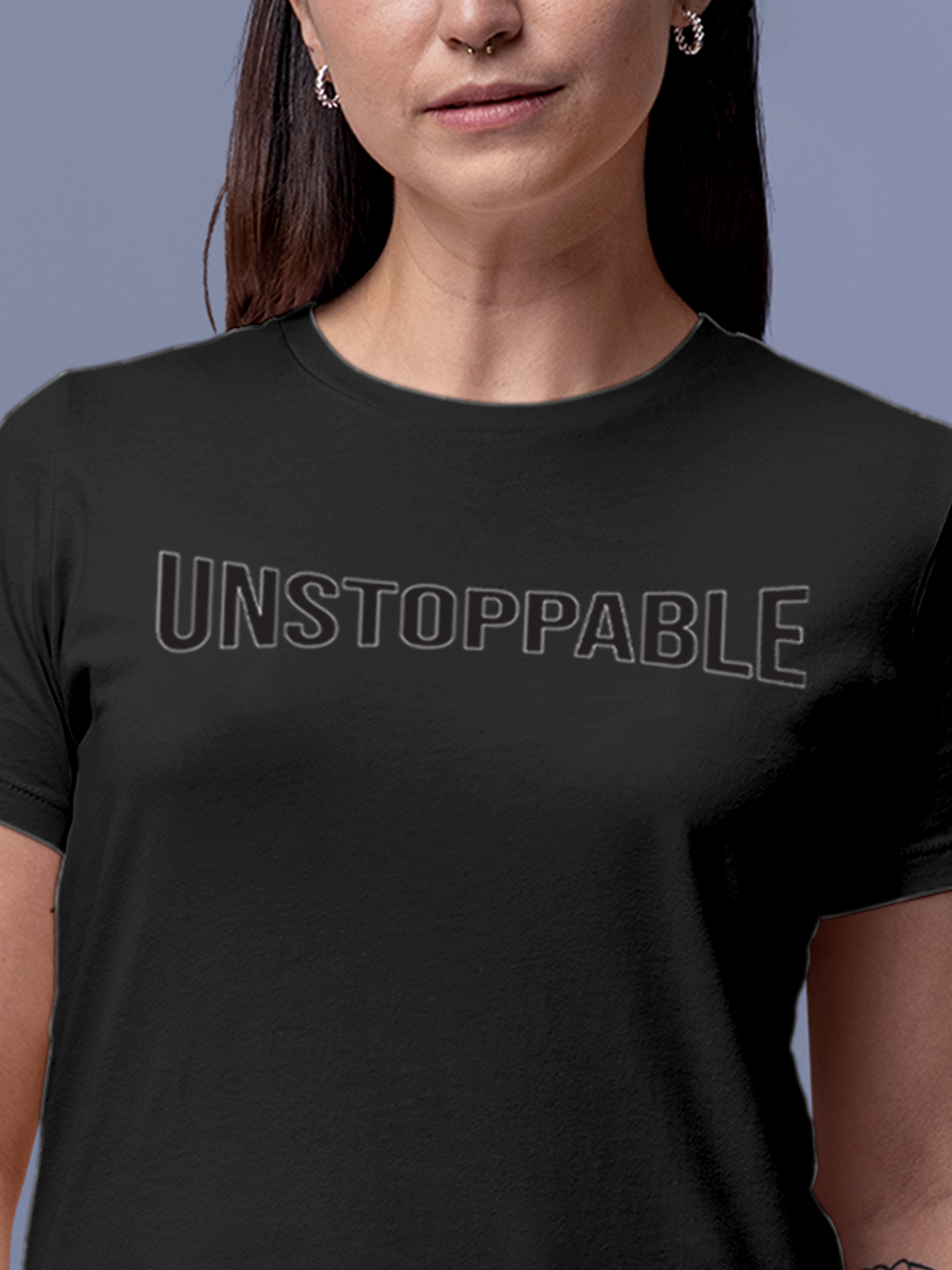 Close up of 'Unstoppable' design on Women's Dark Grey Round Neck T-shirt, highlighting intricate details and vibrant print.