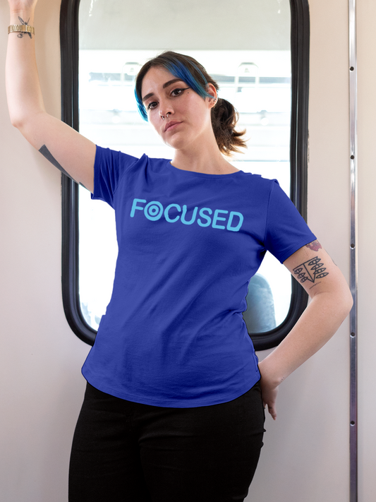 Fighterhero T-shirts: Model wearing Women's Blue Round Neck T-shirt with 'Focused' design