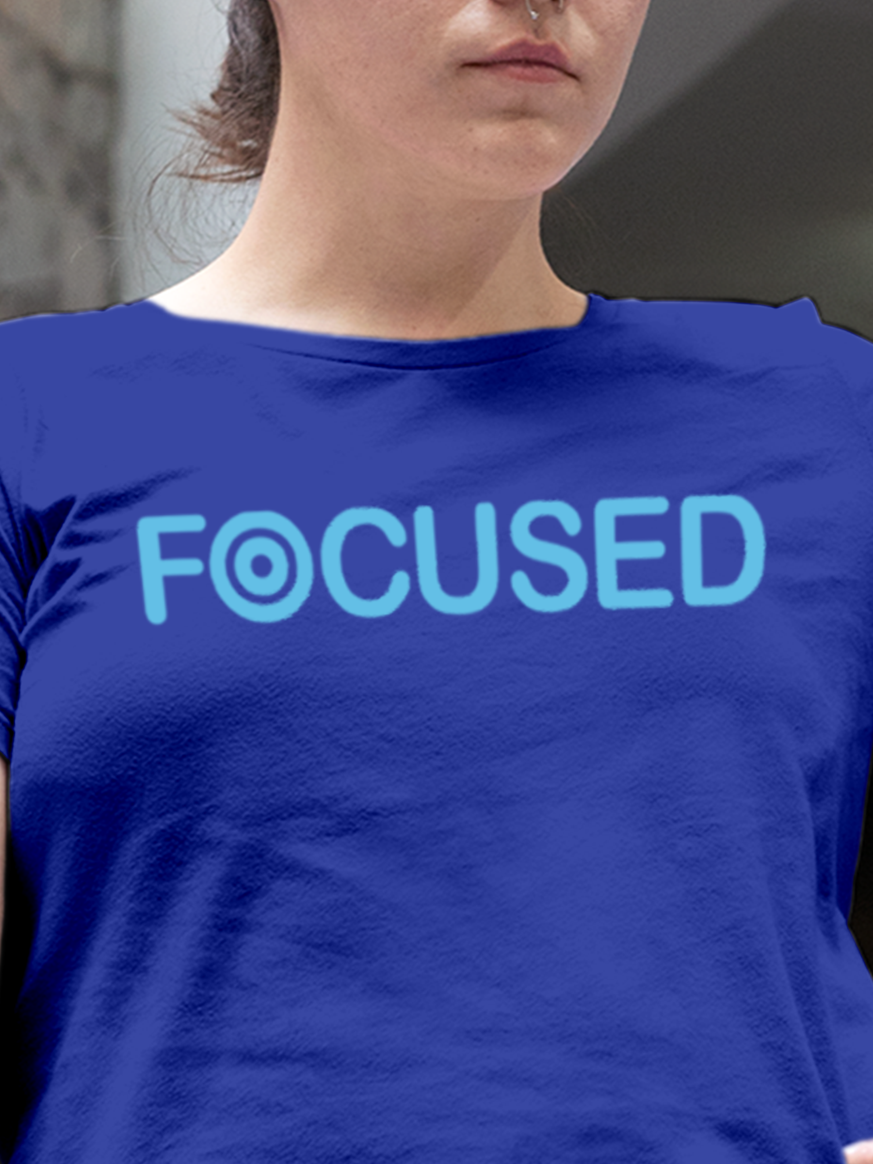 Close up of 'Focused' design on Women's Blue Round Neck T-shirt, highlighting intricate details and vibrant print.