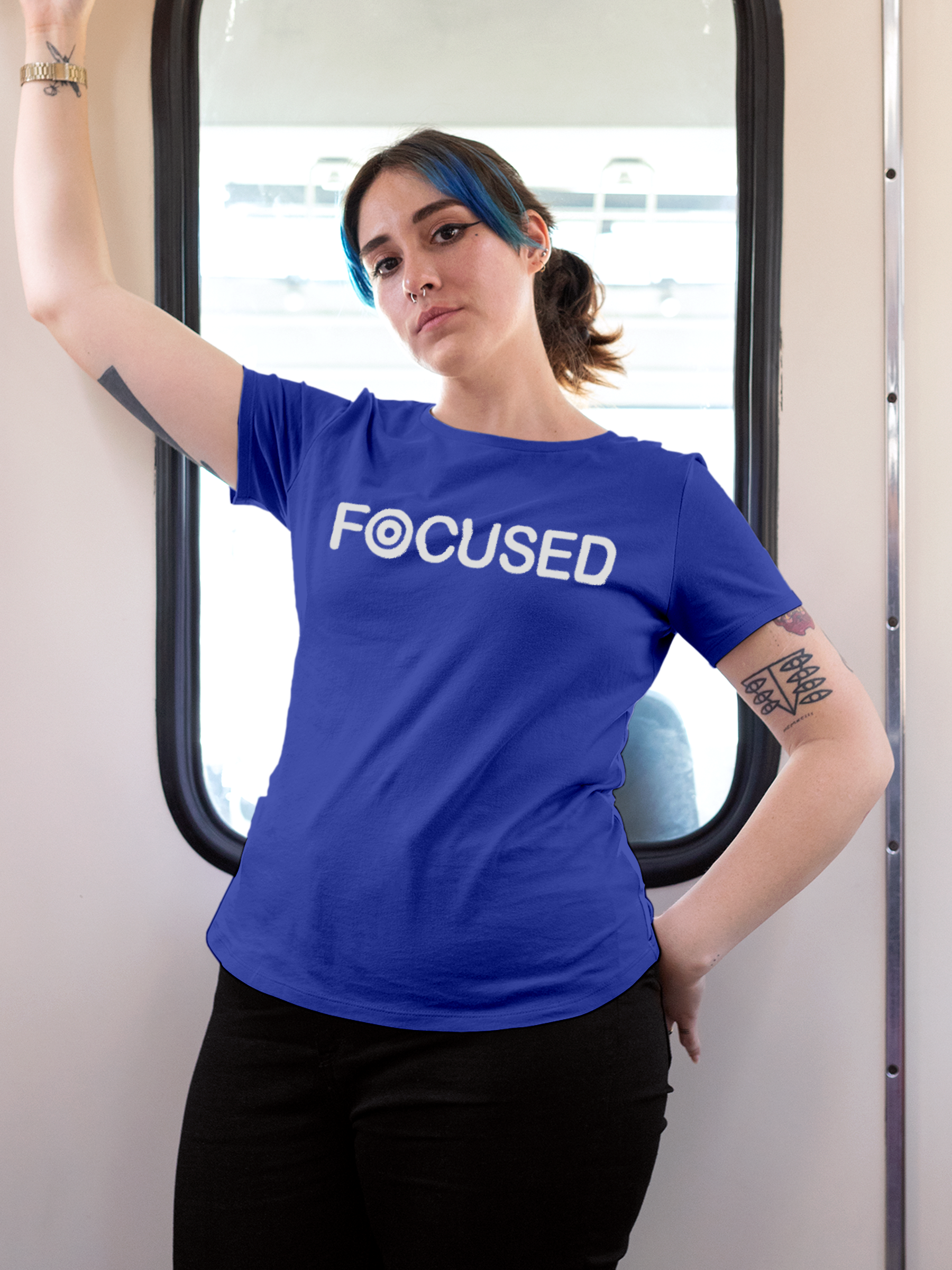 Model wearing Women's Blue Round Neck T-shirt with 'Focused' design, offering effortless style and premium comfort