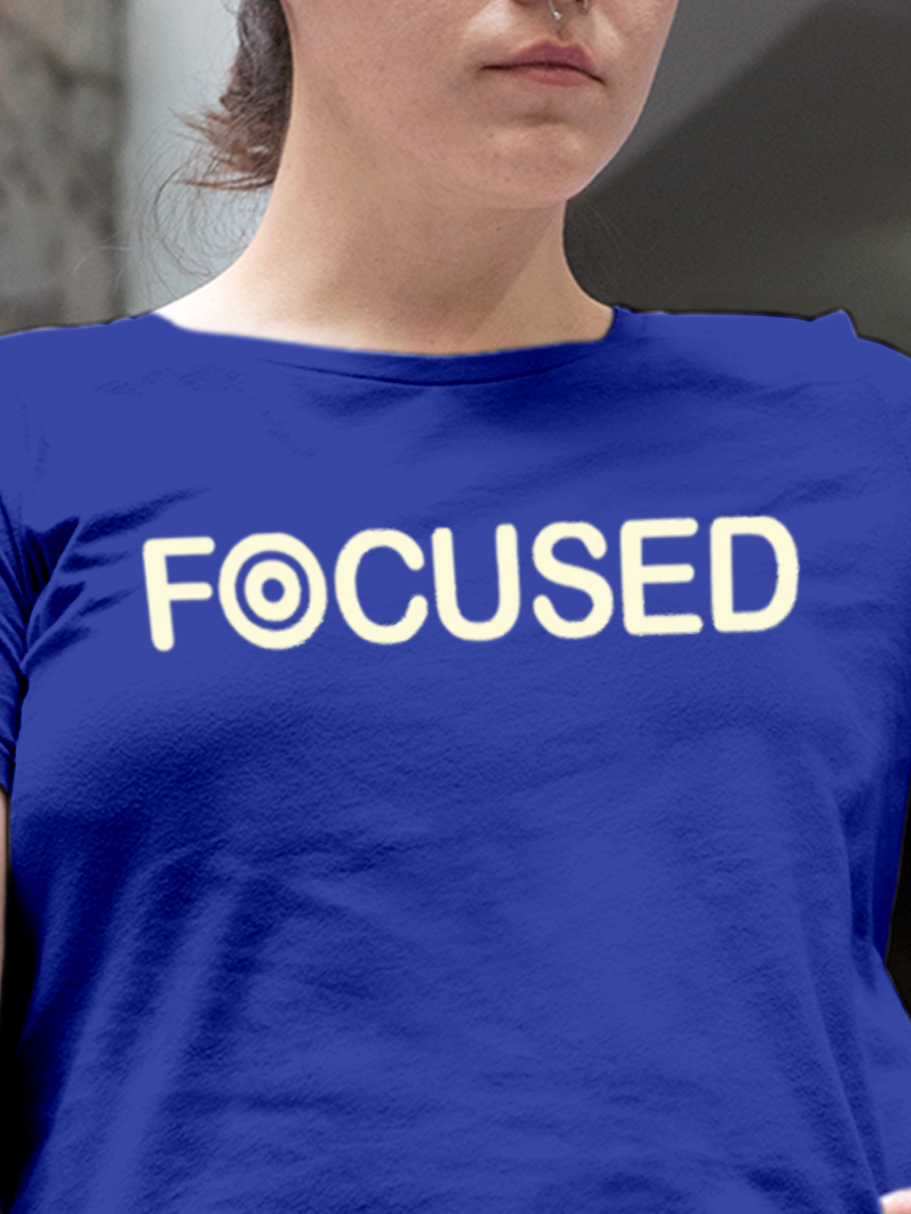 Close up of 'Focused' design on Women's Blue Round Neck T-shirt, highlighting intricate details and vibrant print.