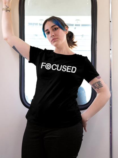 Model wearing Women's Black Round Neck T-shirt with 'Focused' design, offering effortless style and premium comfort