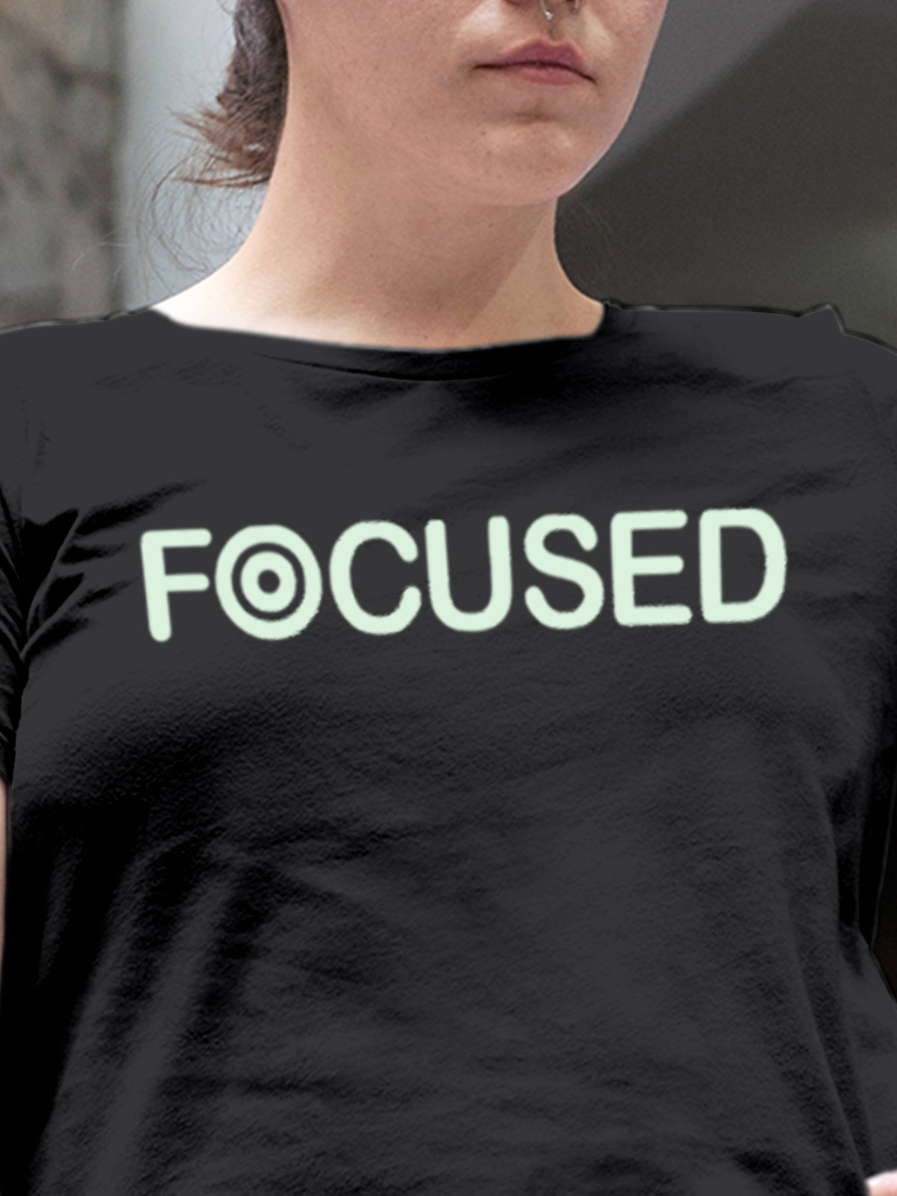 Close up of 'Focused' design on Women's Dark Grey Round Neck T-shirt, highlighting intricate details and vibrant print.