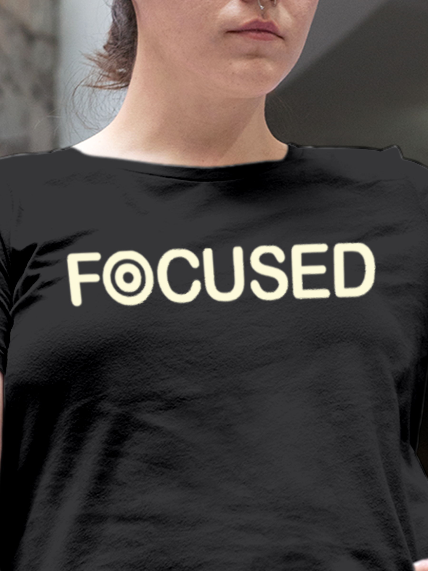 Close up of 'Focused' design on Women's Dark Grey Round Neck T-shirt, highlighting intricate details and vibrant print.