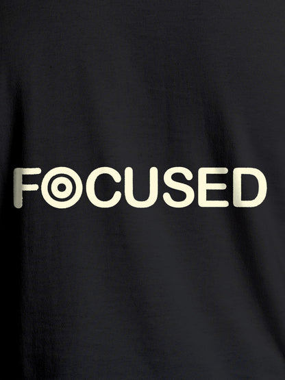 Close up of 'Focused' design on Women's Dark Grey Round Neck T-shirt, highlighting intricate details and vibrant print.
