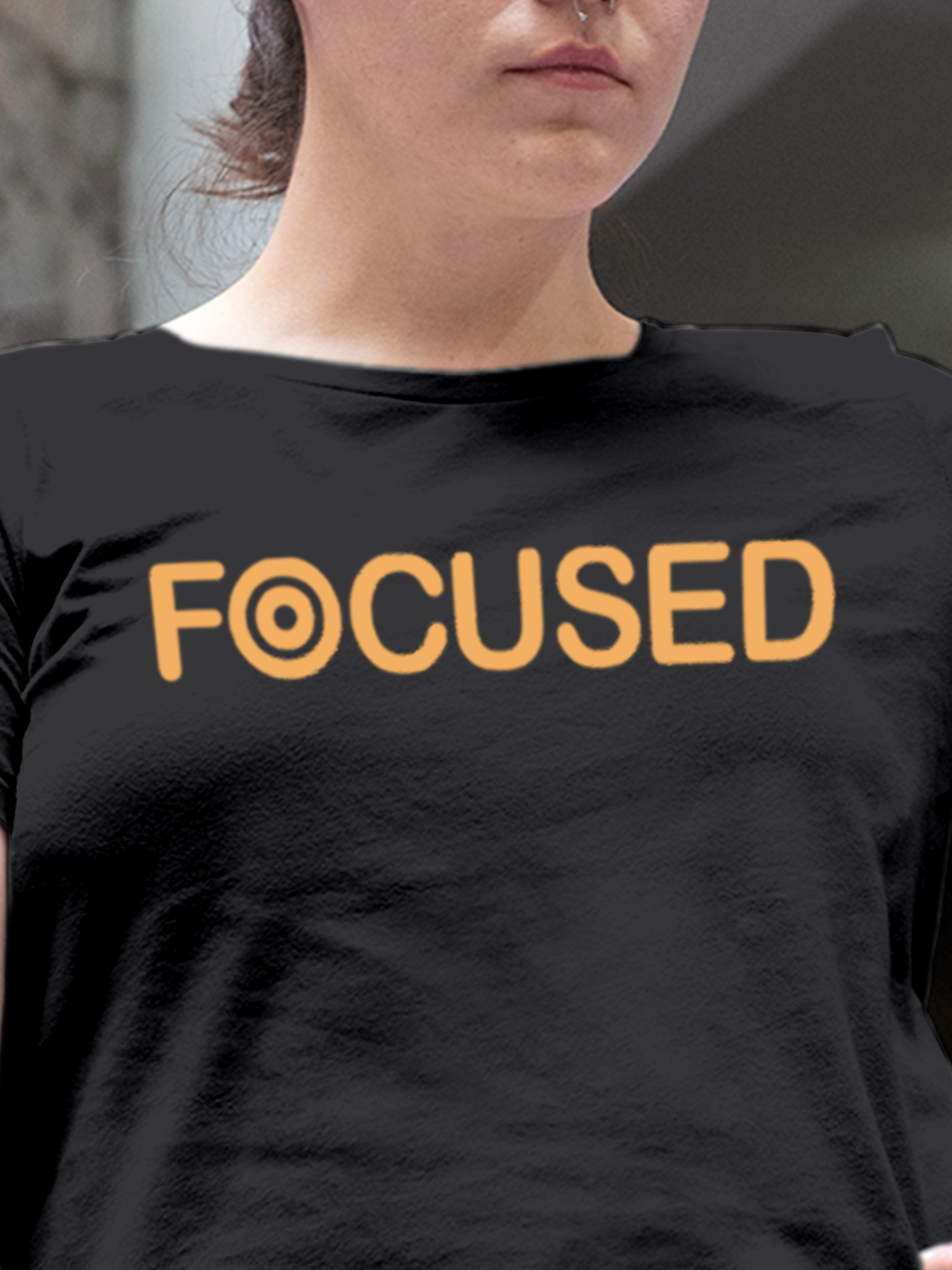 Close up of 'Focused' design on Women's Dark Grey Round Neck T-shirt, highlighting intricate details and vibrant print.