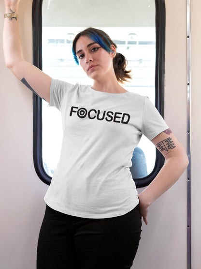 Model wearing Women's White Round Neck T-shirt with 'Focused' design, offering effortless style and premium comfort