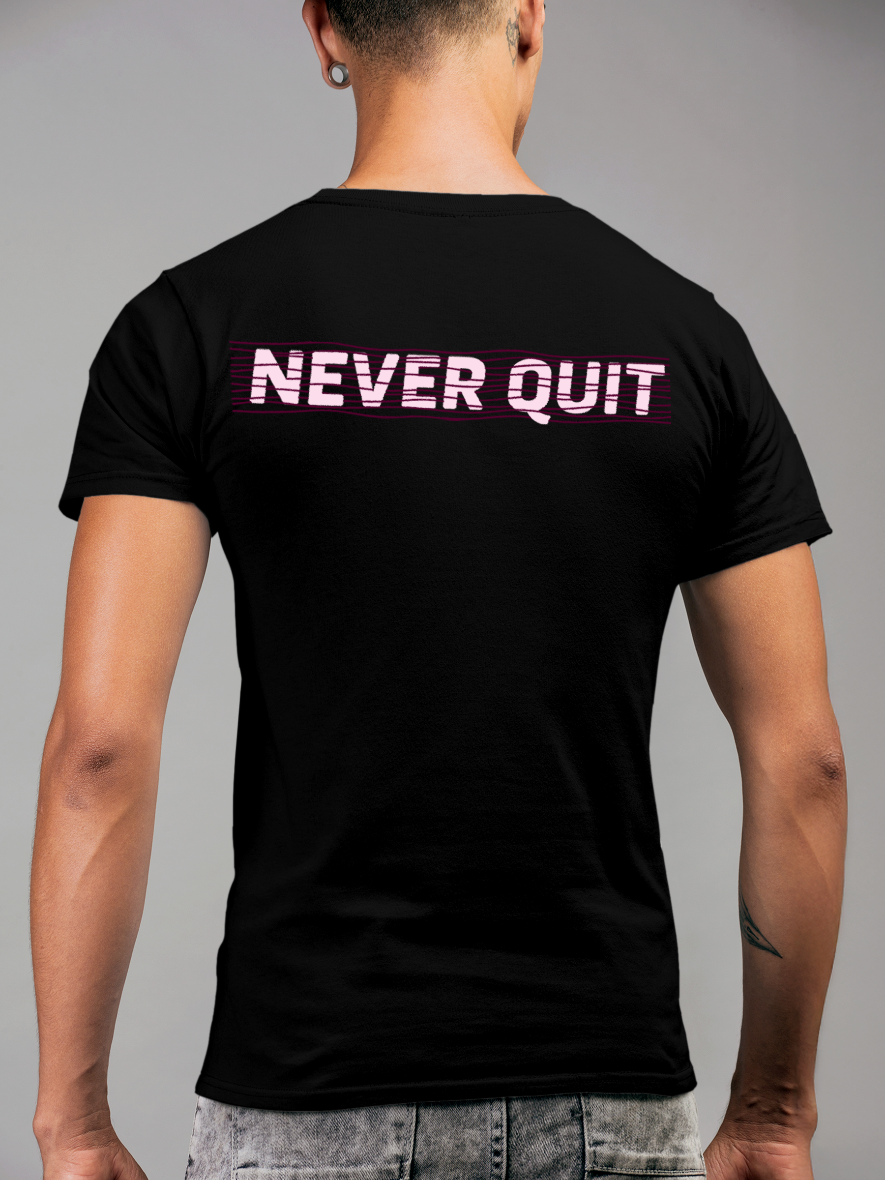 Model wearing Men's Black Round Neck T-shirt with 'Never Quit' design, offering effortless style and premium comfort