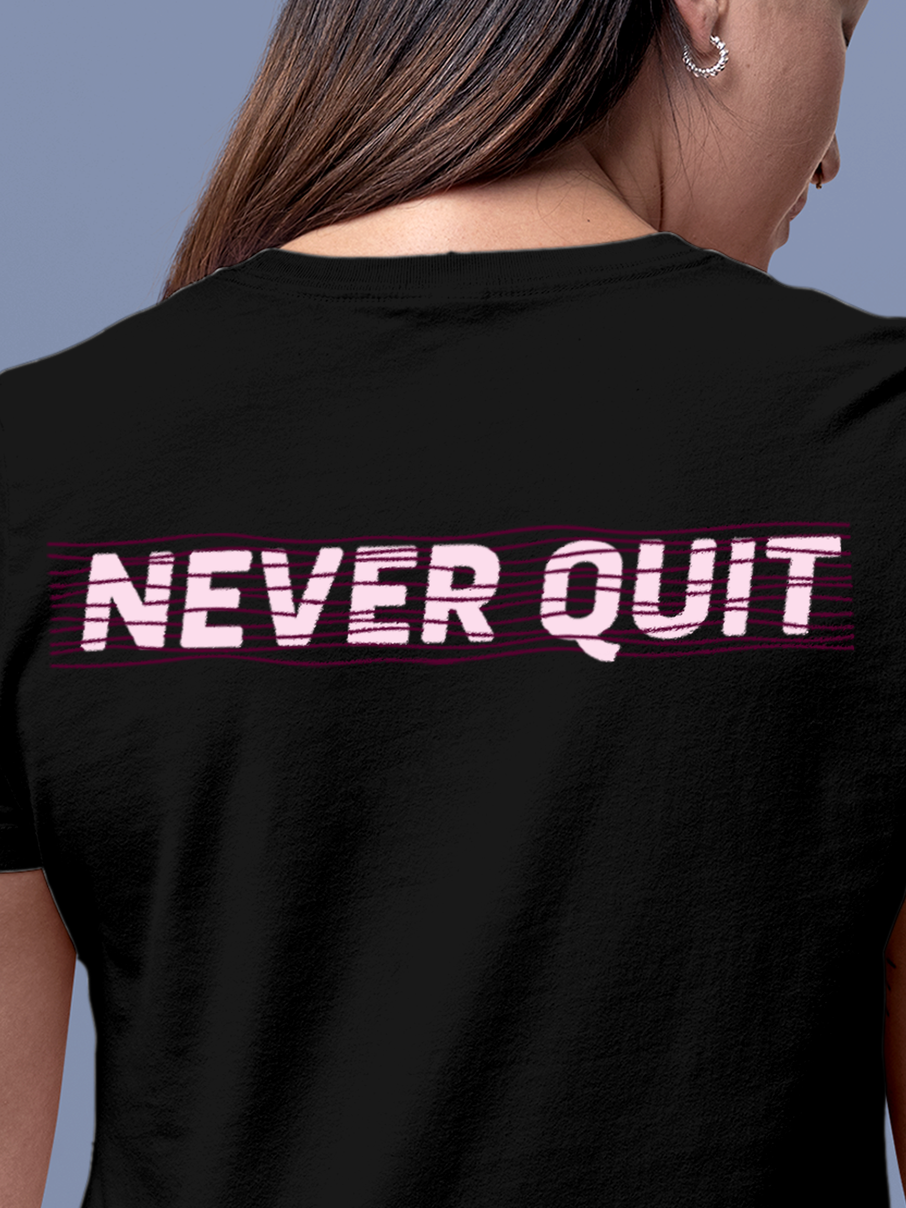 Close up of 'Never Quit' design on Women's Black Round Neck T-shirt, highlighting intricate details and vibrant print.