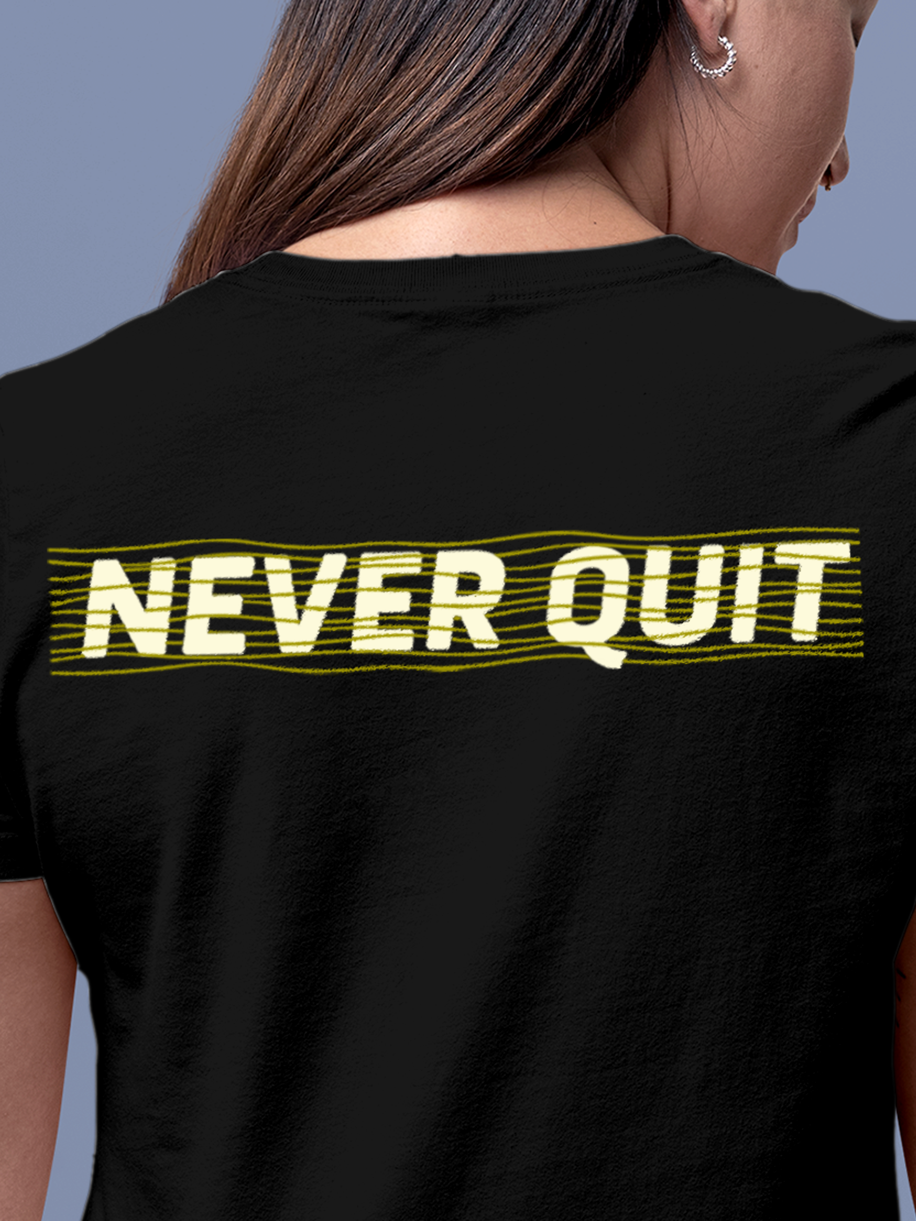 Close up of 'Never Quit' design on Women's Black Round Neck T-shirt, highlighting intricate details and vibrant print.