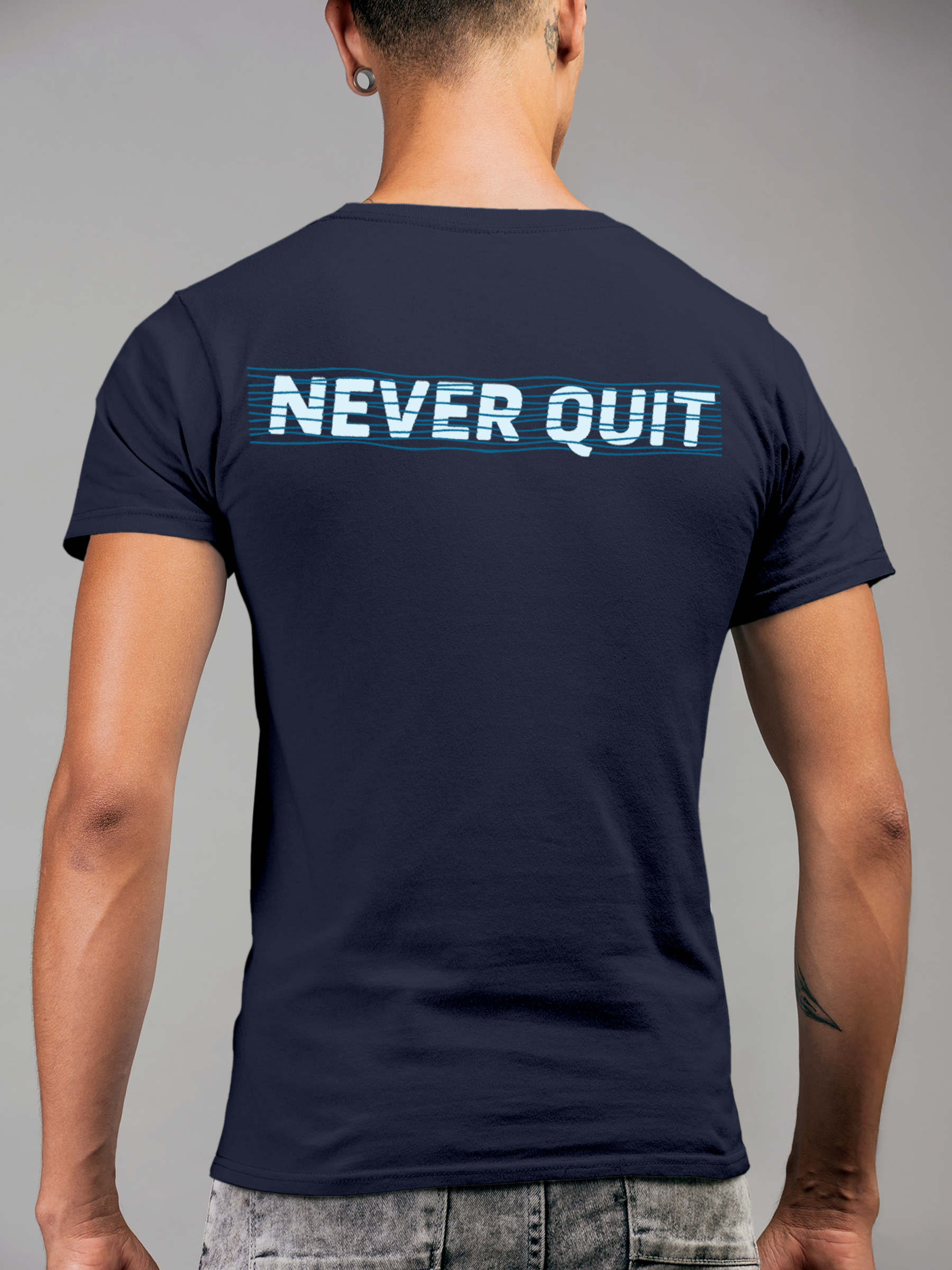 Model wearing Men's Navy Blue Round Neck T-shirt with 'Never Quit' design, offering effortless style and premium comfort
