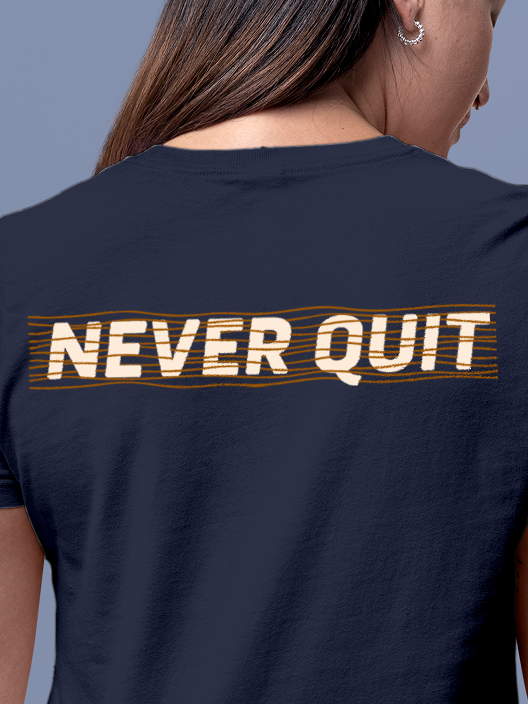 Close up of 'Never Quit' design on Women's Navy Blue Round Neck T-shirt, highlighting intricate details and vibrant print.