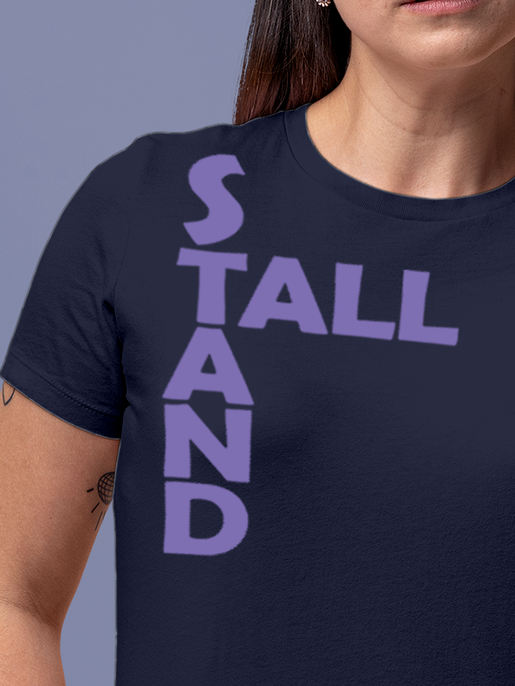 Close up of 'Stand Tall' design on Women's Navy Blue Round Neck T-shirt, highlighting intricate details and vibrant print.