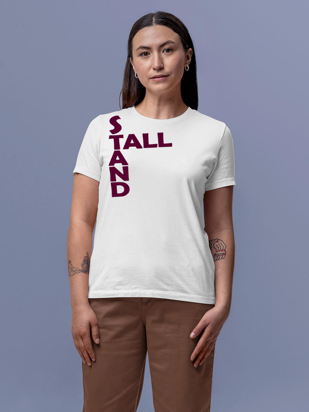 Model wearing Women's White Round Neck T-shirt with 'Stand Tall' design, offering effortless style and premium comfort