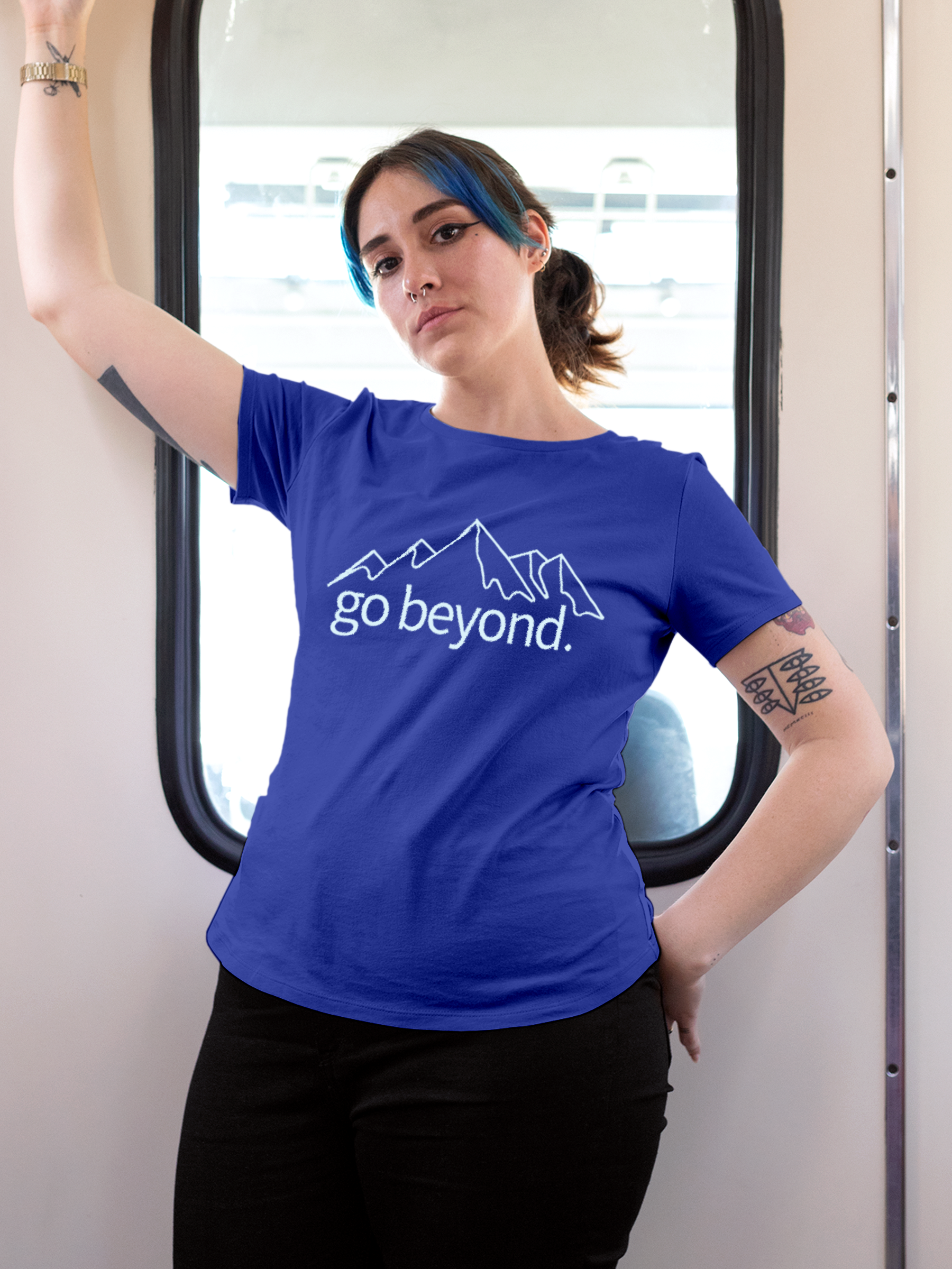 Model wearing Women's Blue Round Neck T-shirt with 'Go Beyond' design, offering effortless style and premium comfort