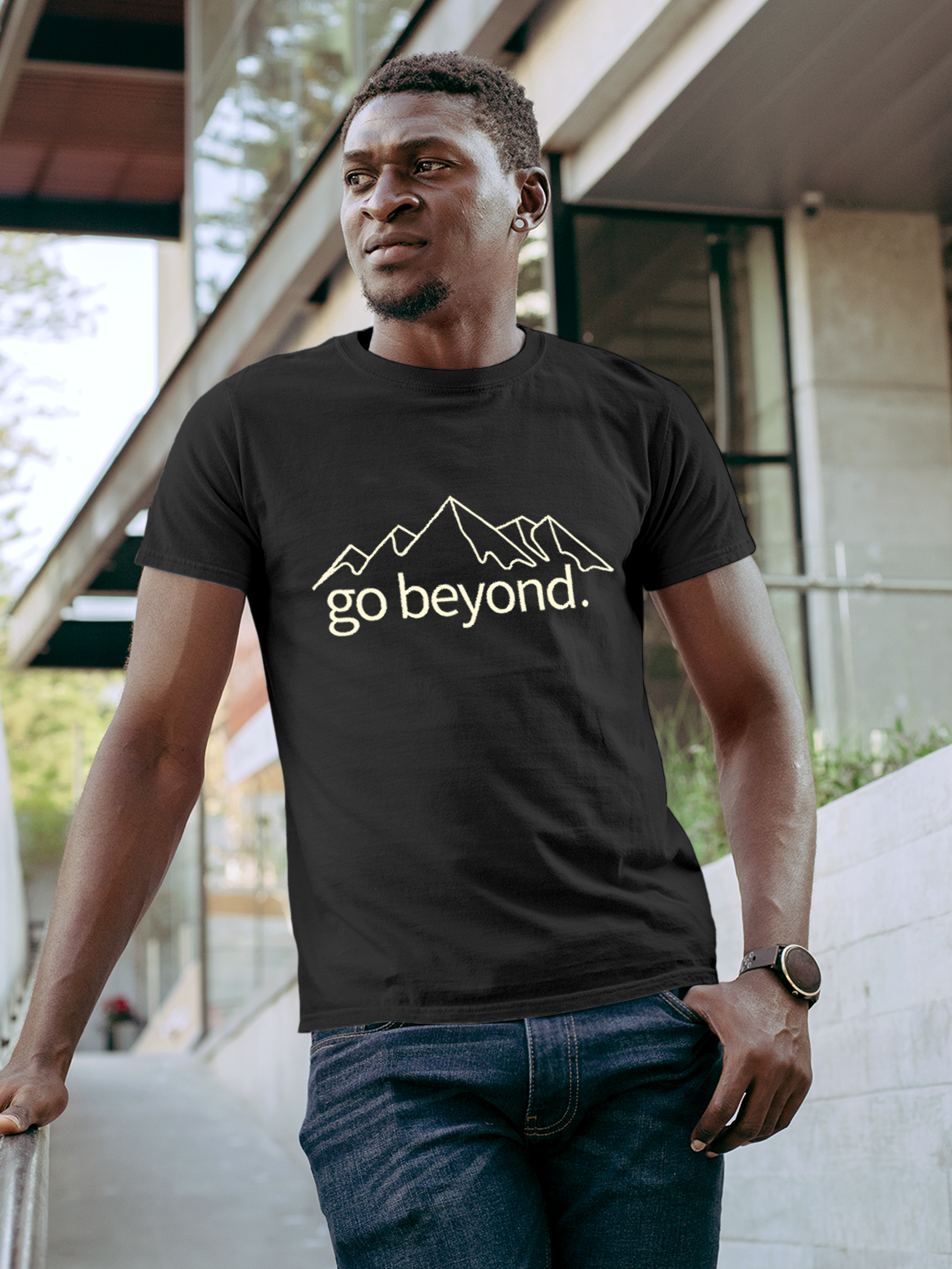 Model wearing Men's Charcoal Grey Round Neck T-shirt with 'Go Beyond' design, offering effortless style and premium comfort