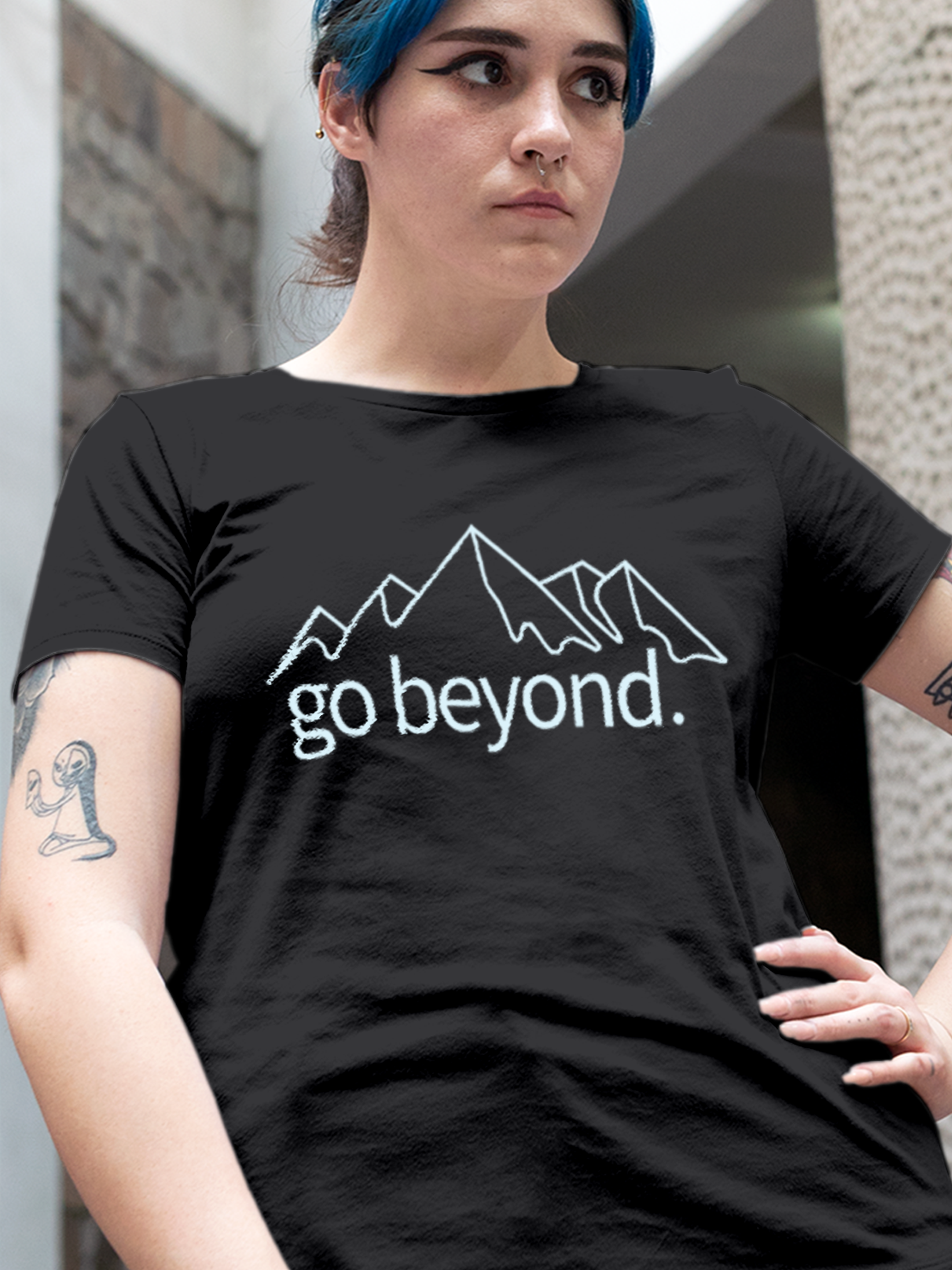 Close up of 'Go Beyond' design on Women's Charcoal Grey Round Neck T-shirt, highlighting intricate details and vibrant print.