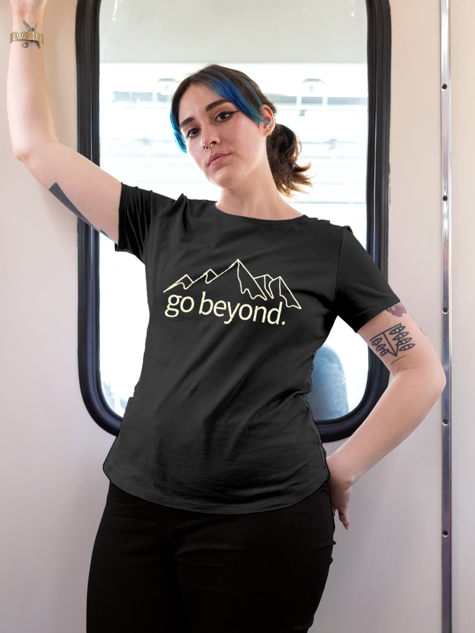 Model wearing Women's Charcoal Grey Round Neck T-shirt with 'Go Beyond' design, offering effortless style and premium comfort
