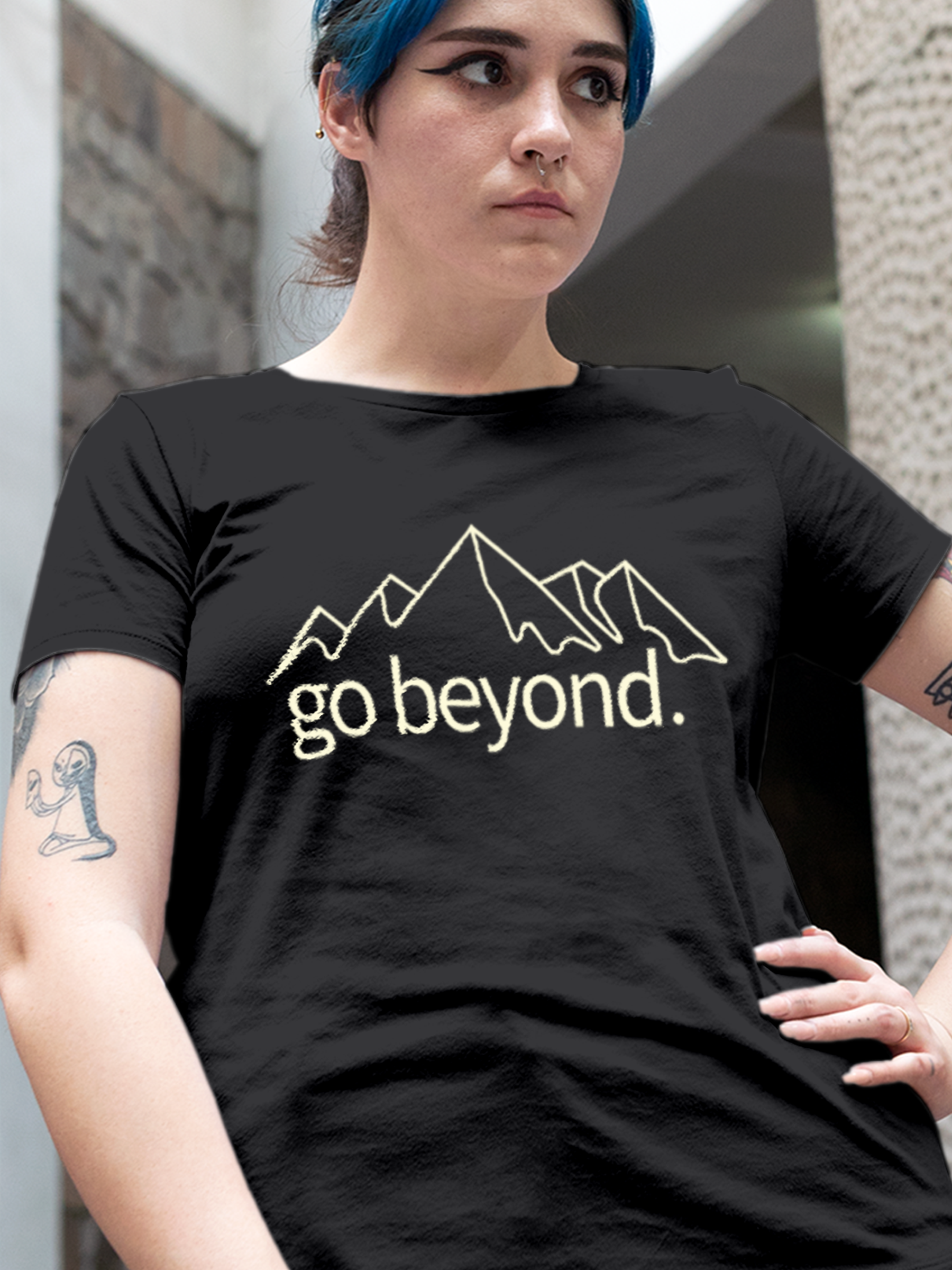 Close up of 'Go Beyond' design on Women's Charcoal Grey Round Neck T-shirt, highlighting intricate details and vibrant print.