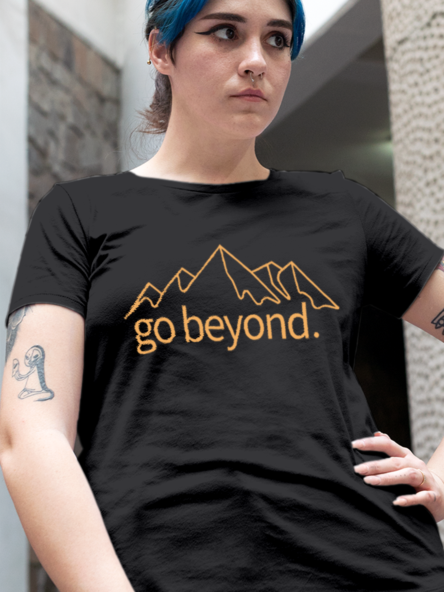 Close up of 'Go Beyond' design on Women's Charcoal Grey Round Neck T-shirt, highlighting intricate details and vibrant print.