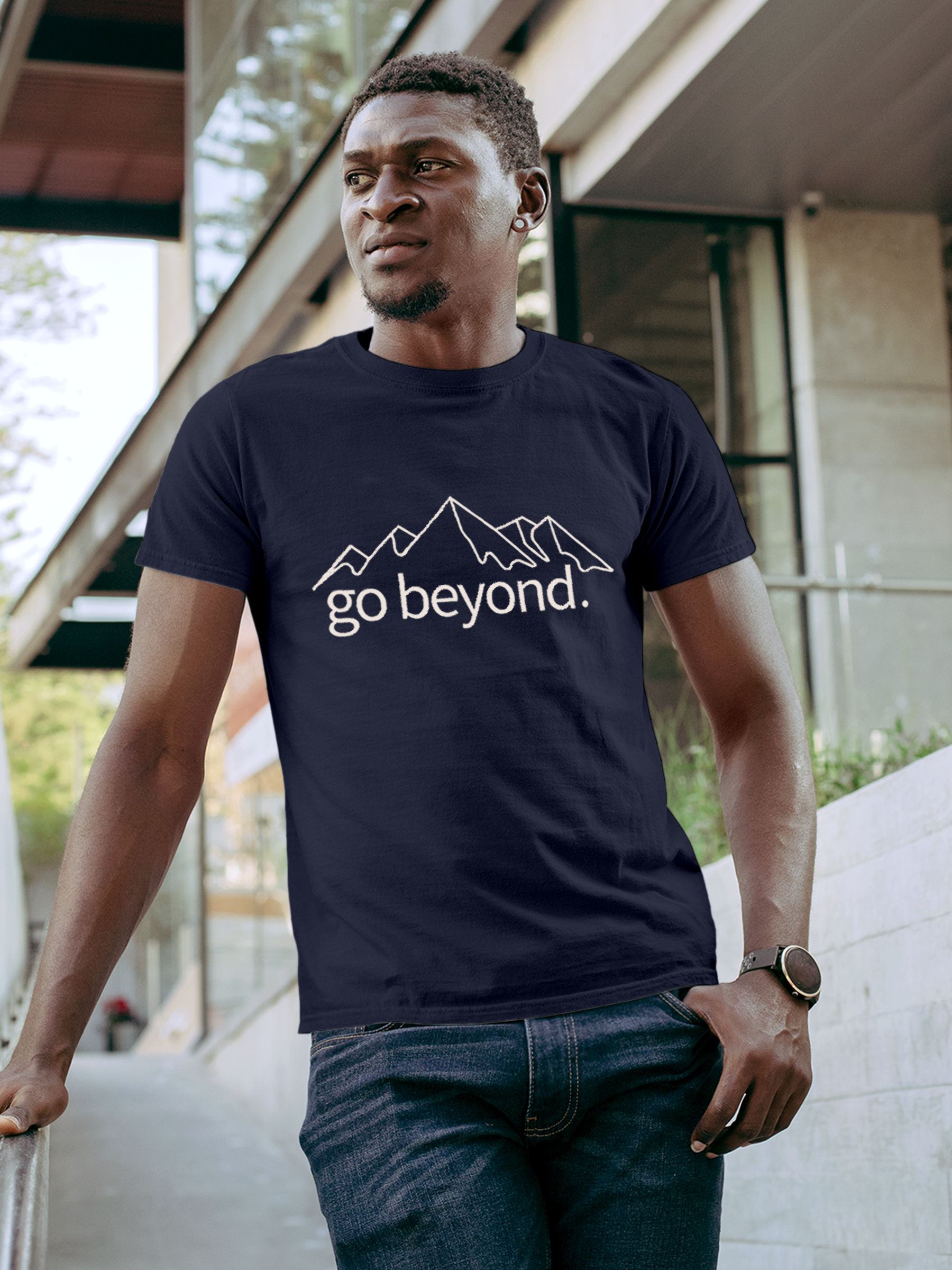 Model wearing Men's Navy Blue Round Neck T-shirt with 'Go Beyond' design, offering effortless style and premium comfort