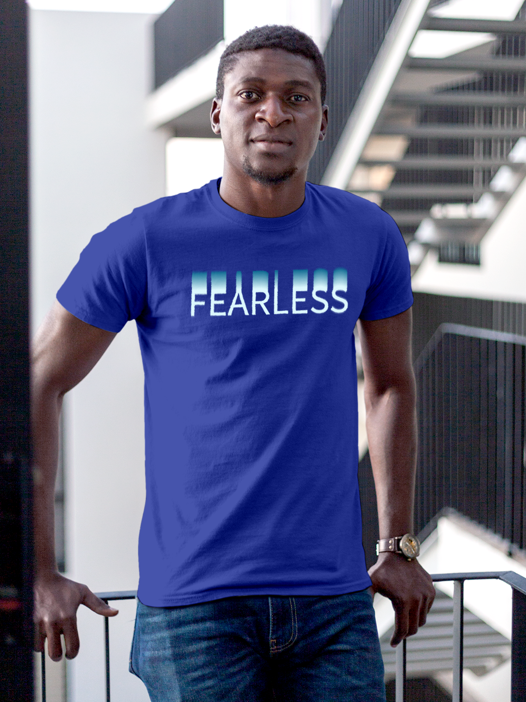 Model wearing Men's Blue Round Neck T-shirt with 'Fearless' design, offering effortless style and premium comfort