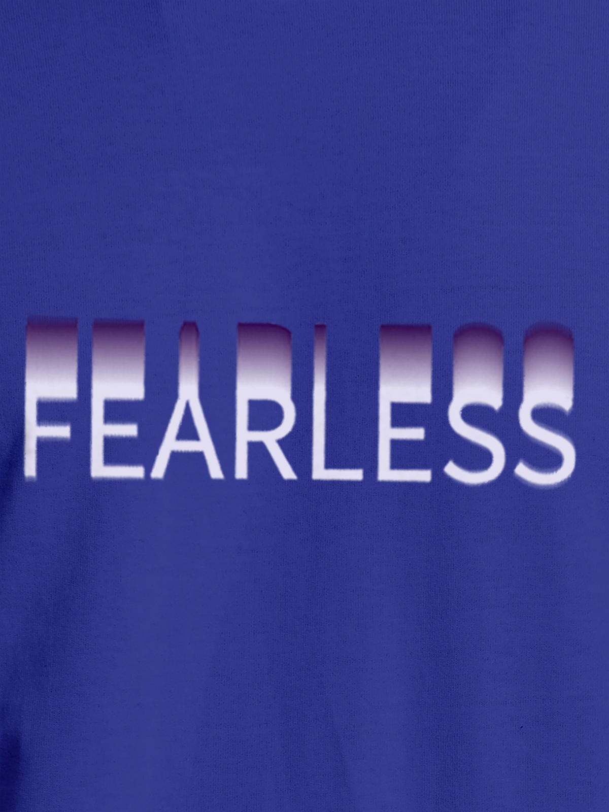 Close up of 'Fearless' design on Men's Blue Round Neck T-shirt, highlighting intricate details and vibrant print.