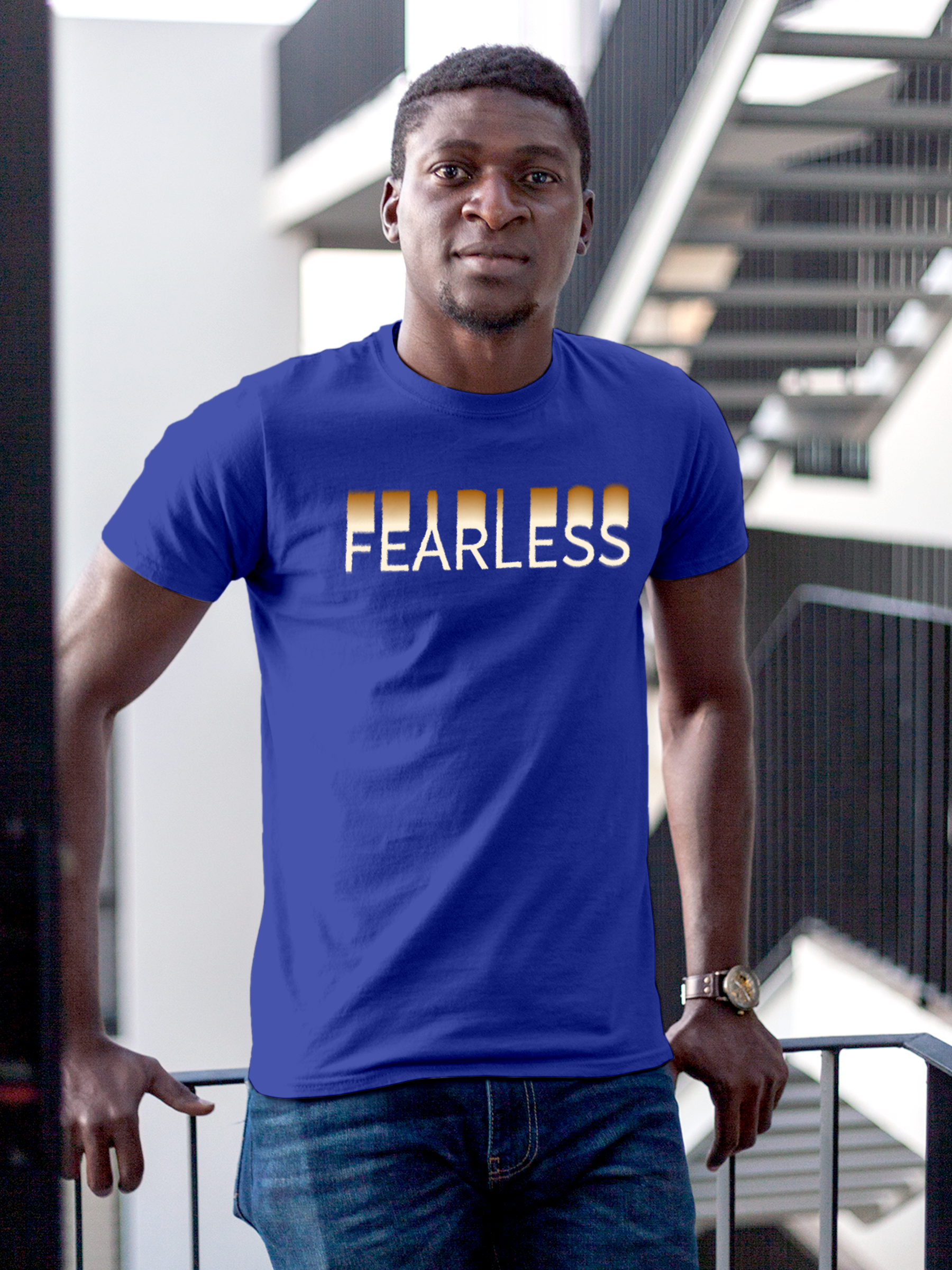 Model wearing Men's Blue Round Neck T-shirt with 'Fearless' design, offering effortless style and premium comfort