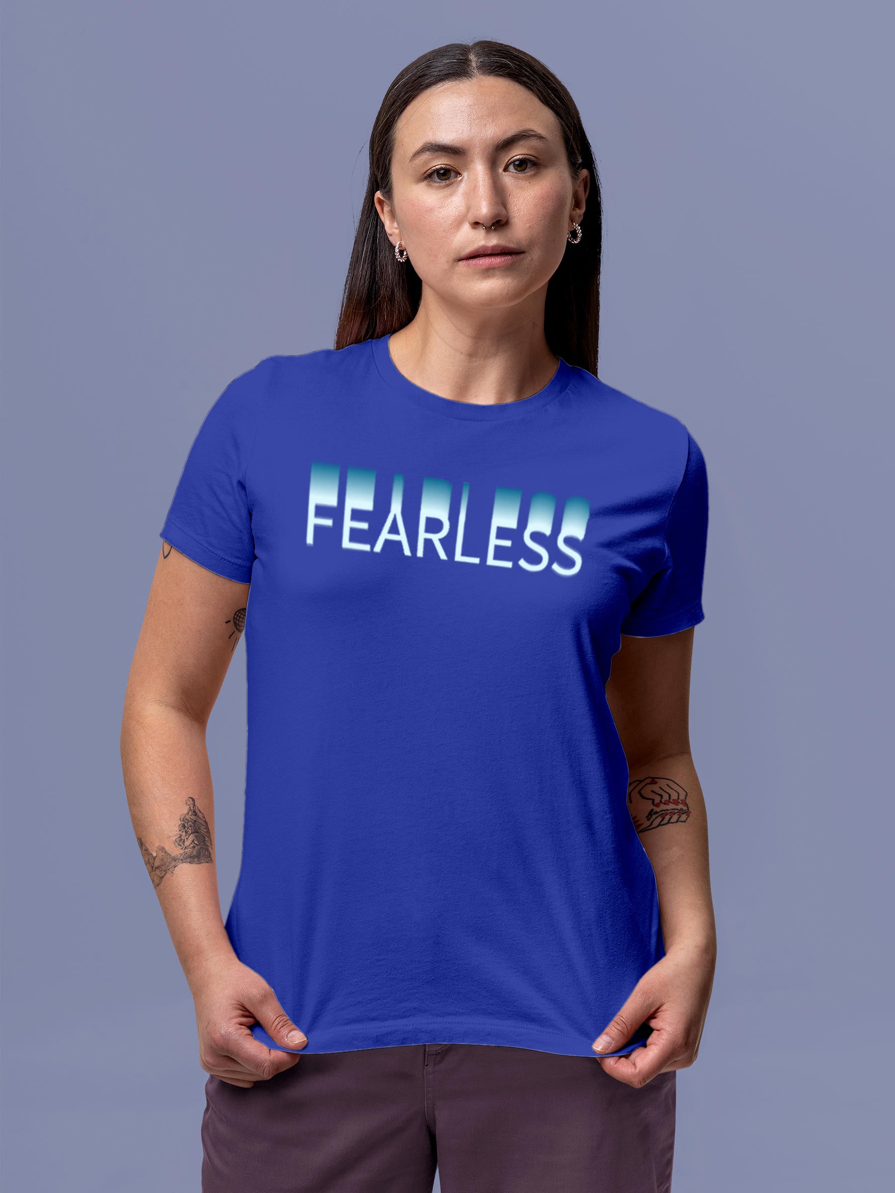 Model wearing Women's Blue Round Neck T-shirt with 'Fearless' design, offering effortless style and premium comfort